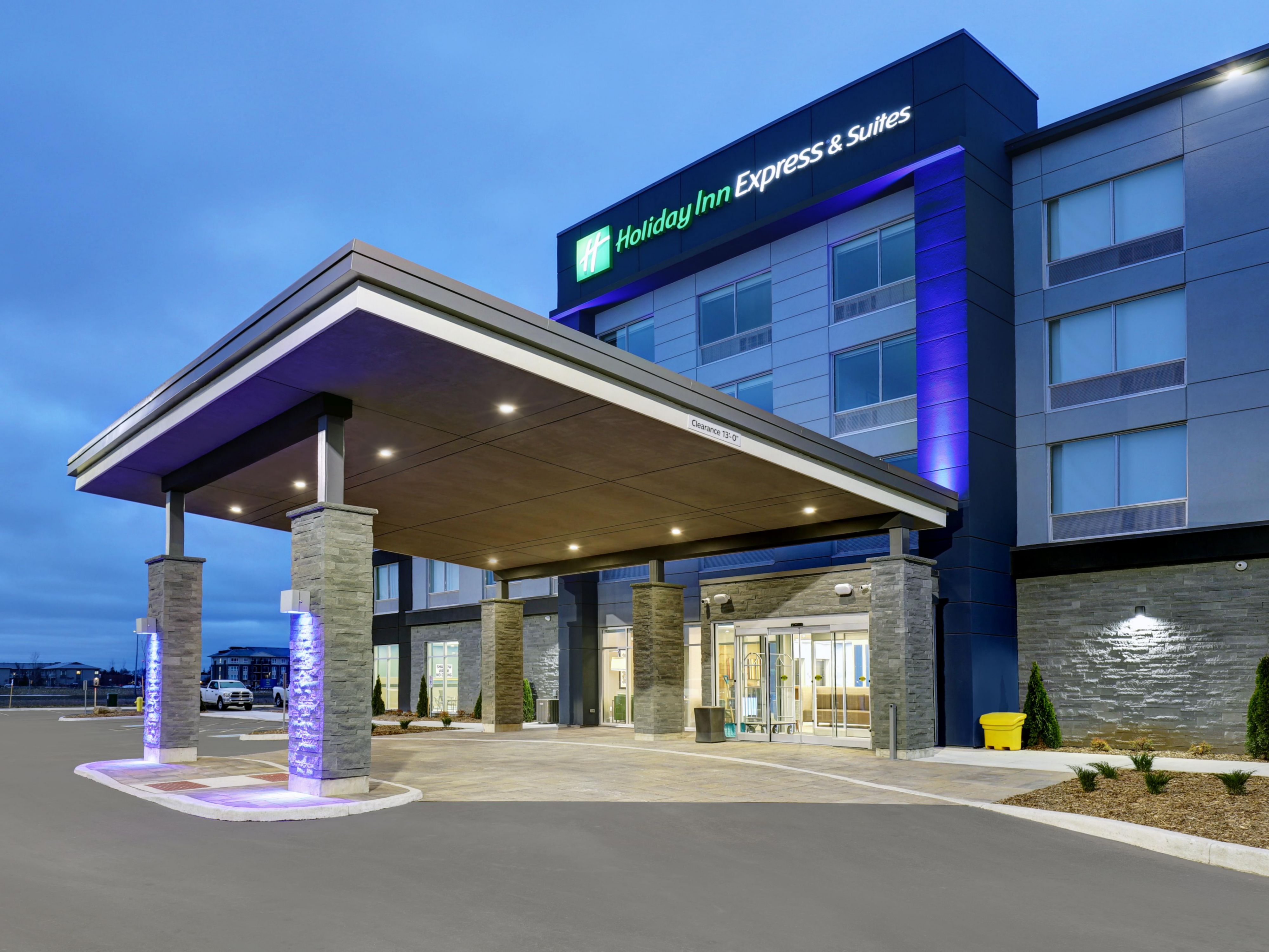 exterior front entrance of hotel at dusk