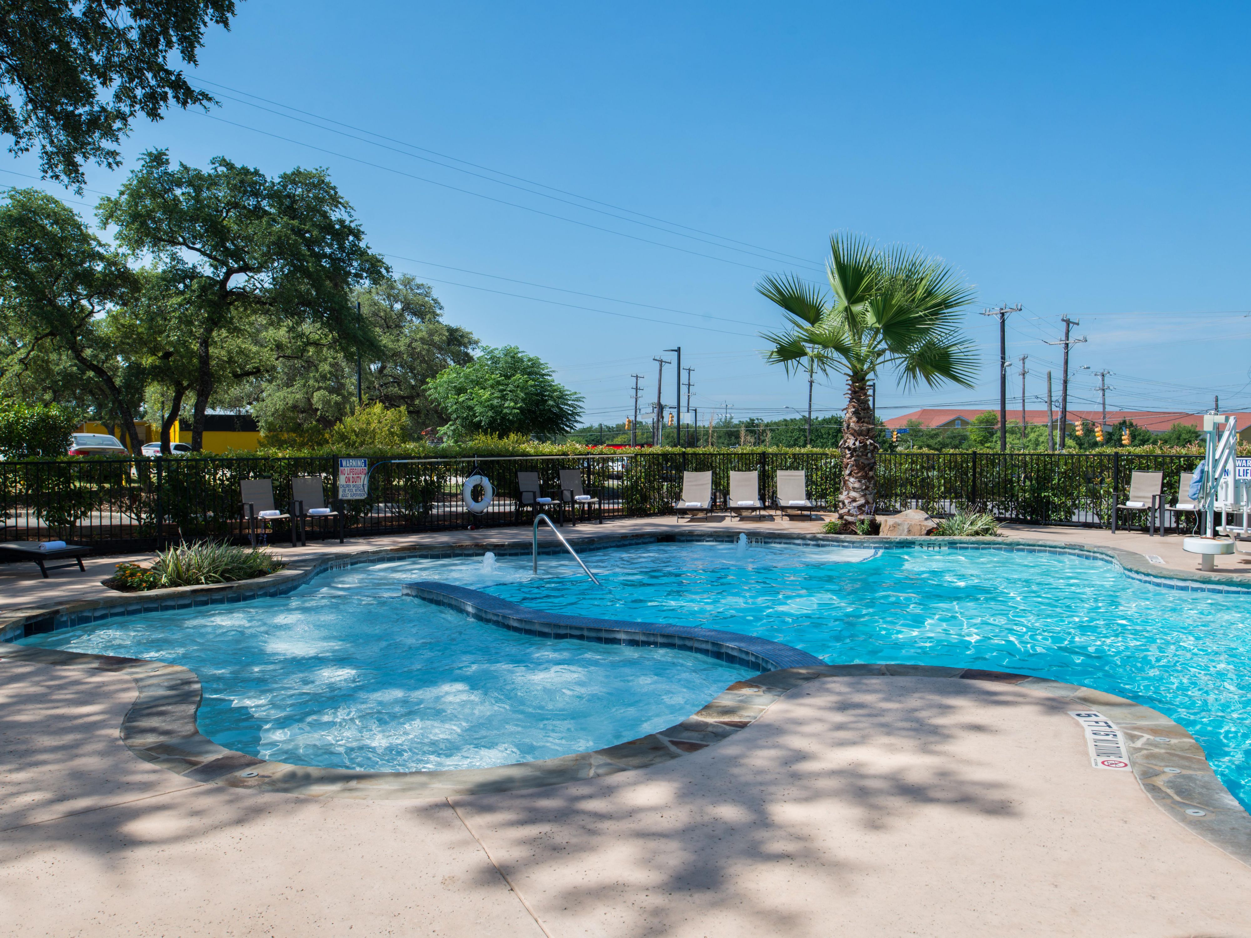 Our San Antonio hotel features a stunning resort-style outdoor pool, complete with a soothing waterfall and a separate children's pool for family fun. Whether you're looking to relax or let the kids splash around this beautiful pool is the perfect spot. Open daily from 10:00 AM to 10:00 PM, it’s an ideal place to unwind and create lasting memories.
