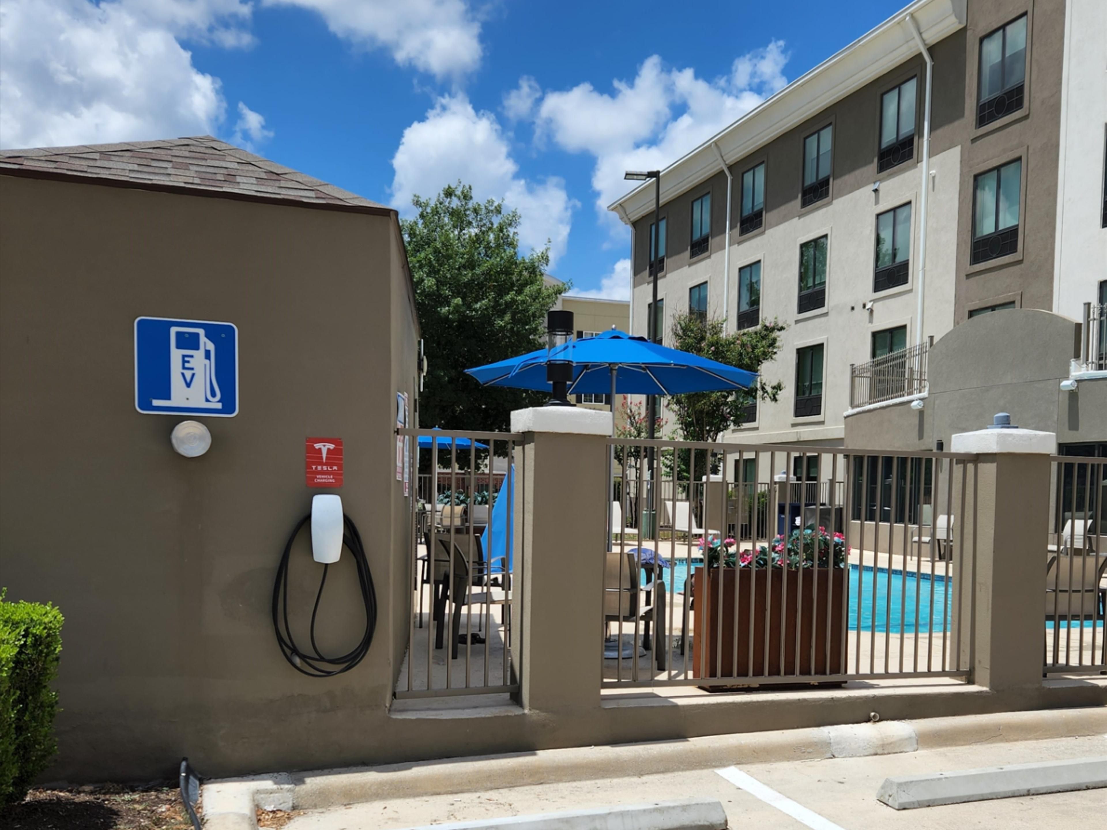 Rest and recharge both your body and vehicle with our convenient and complimentary Tesla EV charging station. Located at the back of our parking lot, easily power up your vehicle while you relax in our comfortable accommodations. Enjoy the peace of mind that comes with knowing your car is charged and ready for the road ahead.