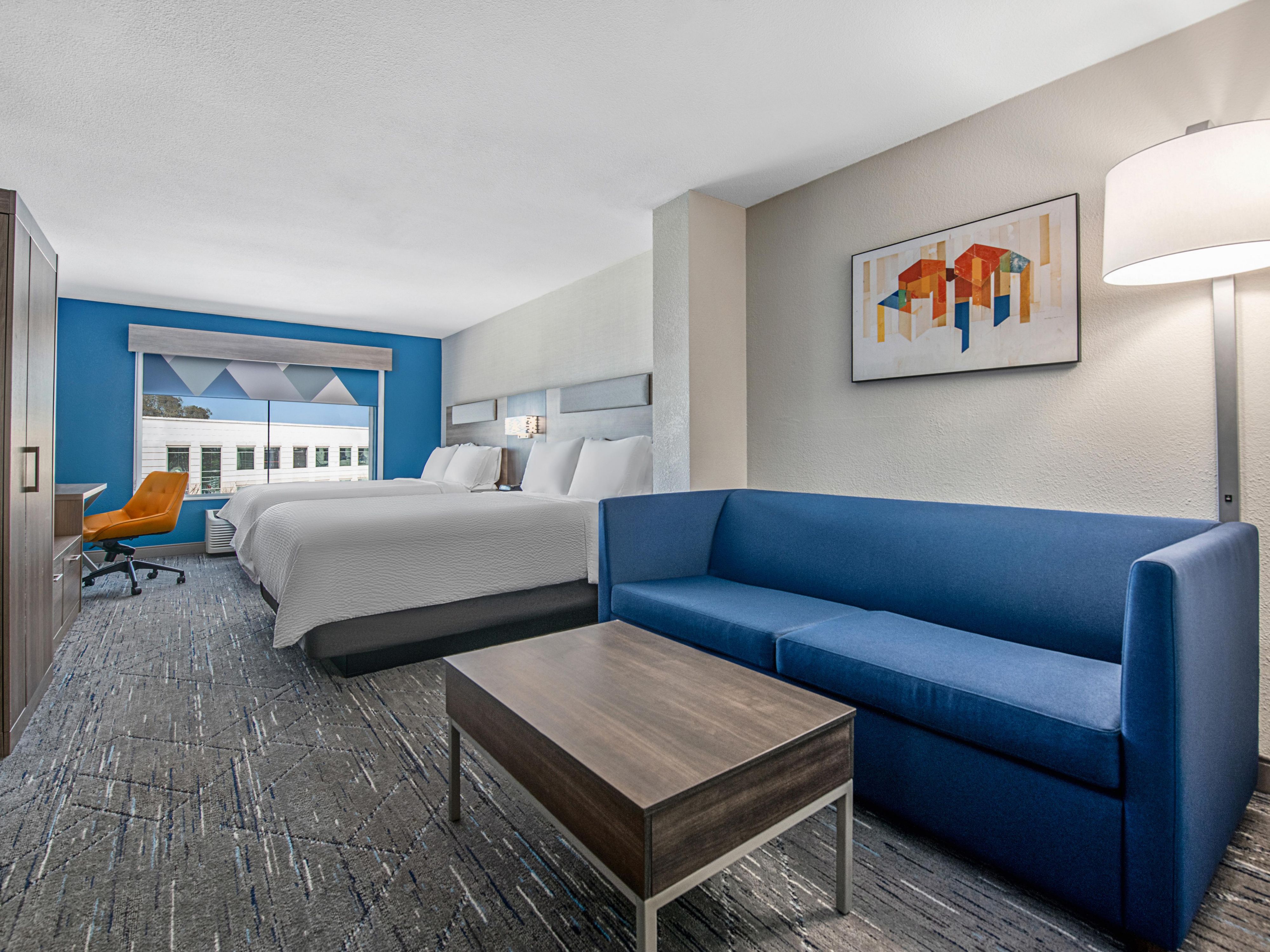 Settle in with a fresh contemporary space in our 2 Queen Suite.