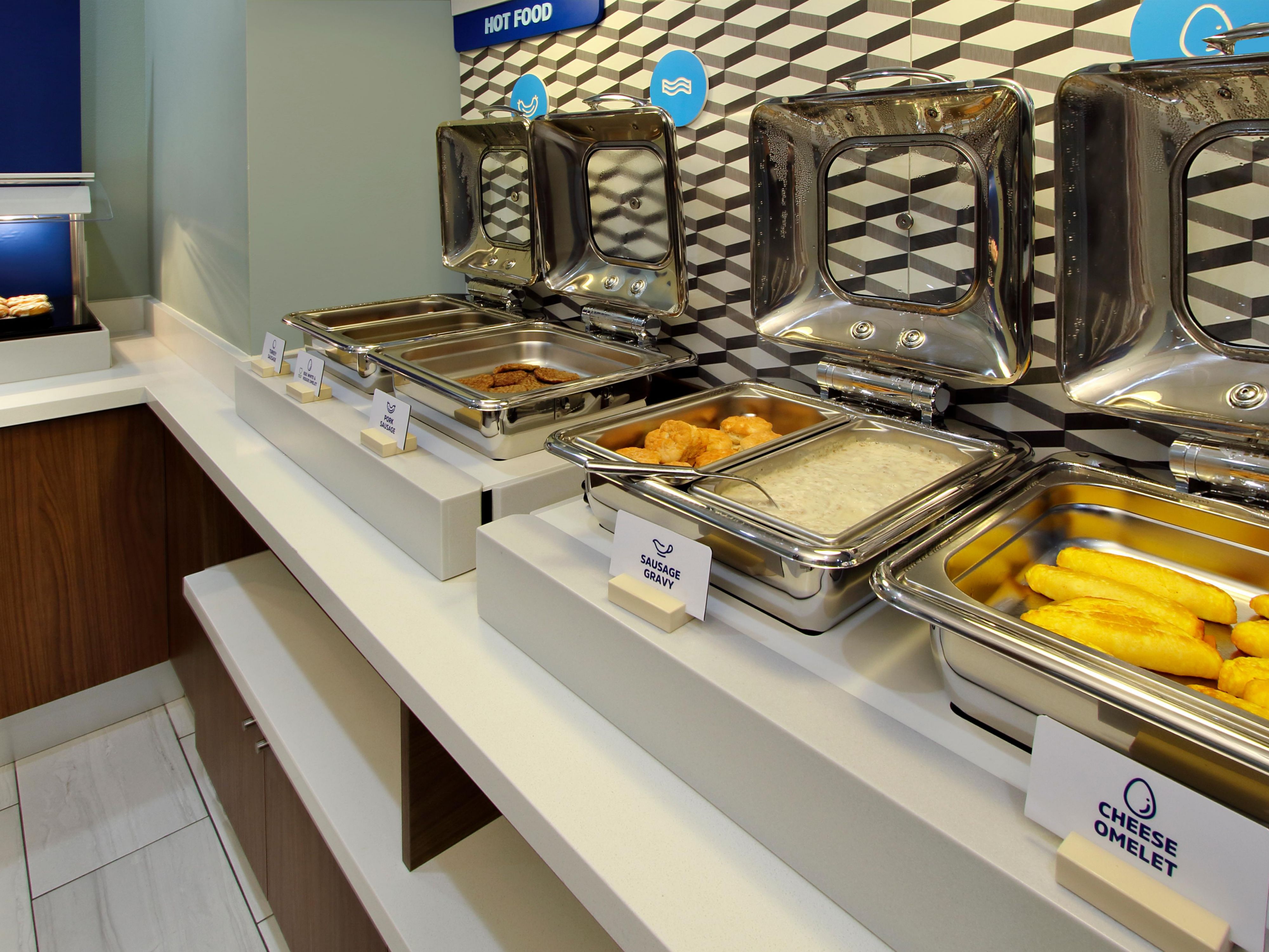  Start your day with a free, hot breakfast, featuring items like eggs, bacon or sausage, pancakes, yogurt, fruit, and a variety of beverages such as coffee and juices.