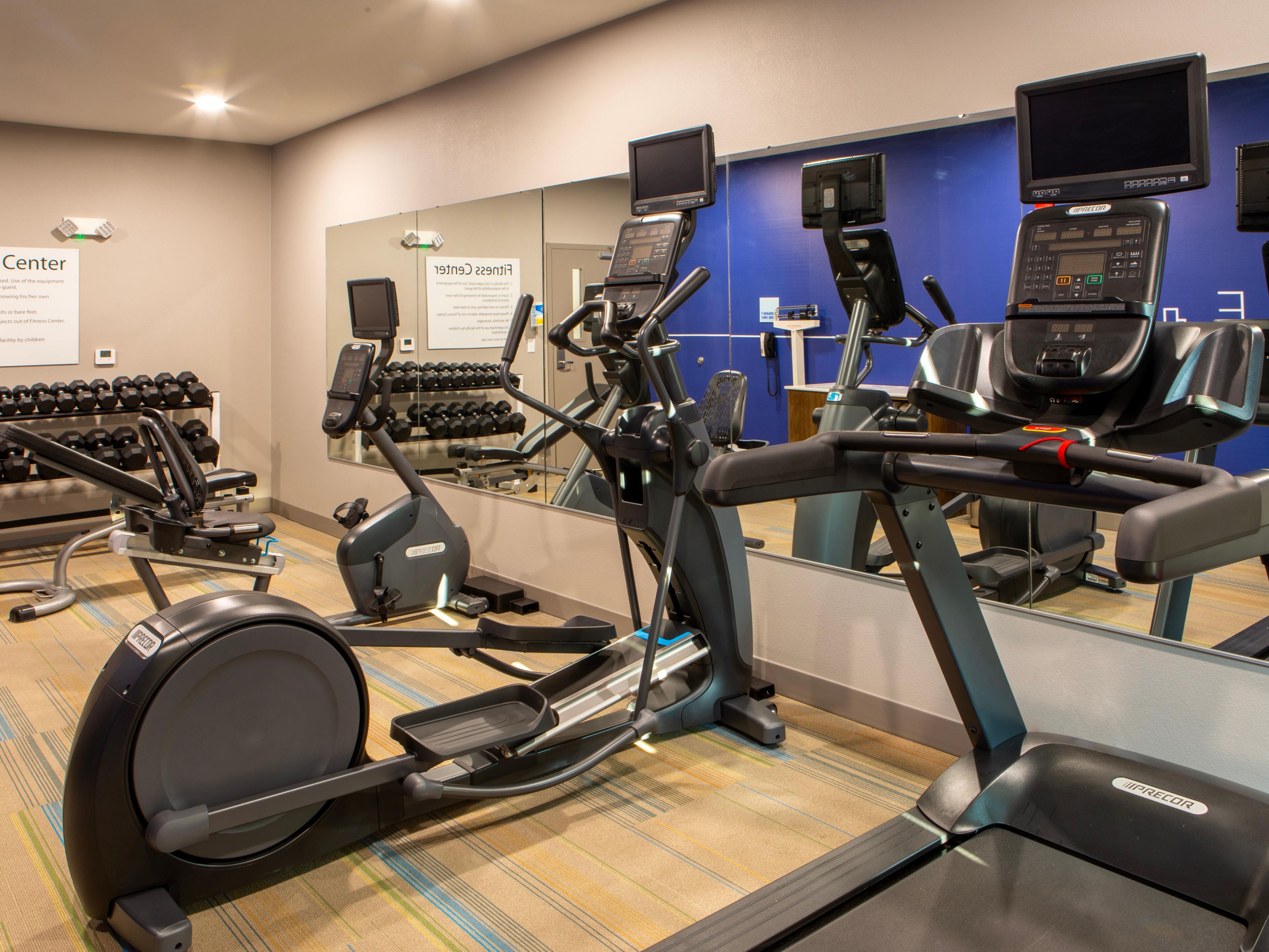 Keep in shape while you are away from home. Check out our fitness facility with free weights!