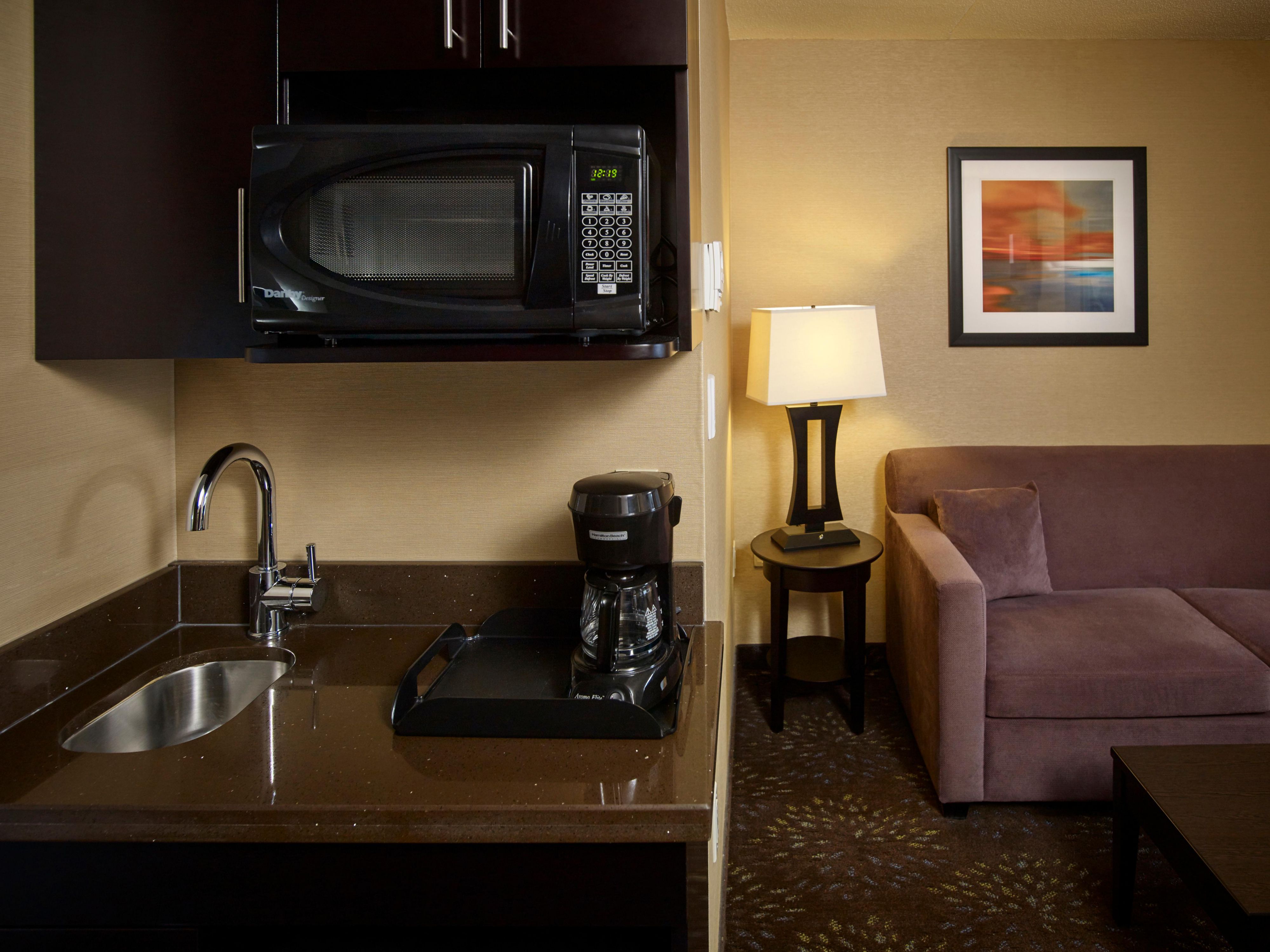 Whether you're warming up a late-night snack, storing your favorite beverages, or enjoying a fresh cup of coffee at your leisure, our amenities are designed to make you feel right at home. Experience the perfect blend of comfort and practicality during your stay with us!