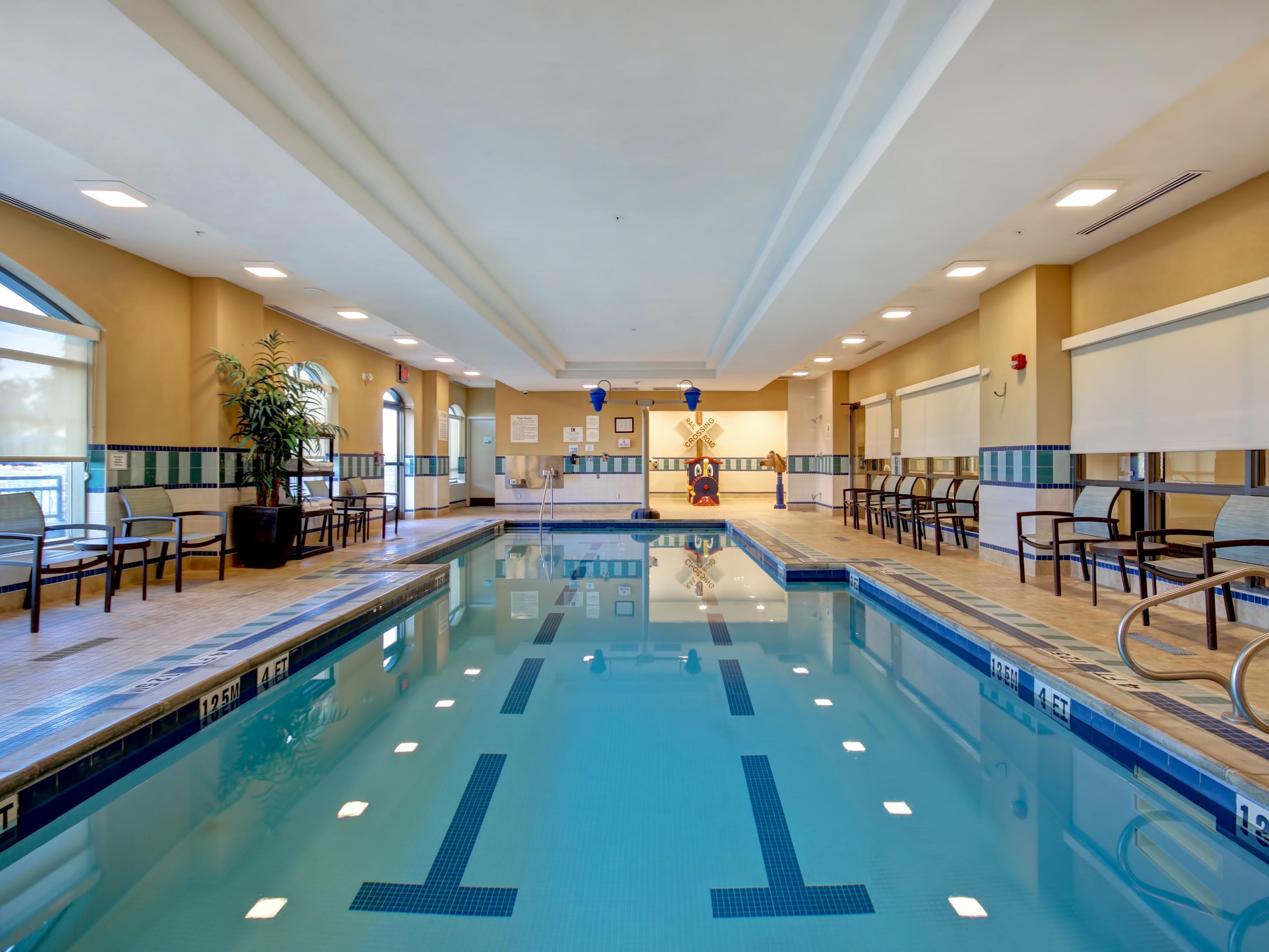 Our Indoor Heated Pool and Splash Pad with Dumping Buckets is perfect for families and open daily from 6:00am-10:00pm. Reservations are required.