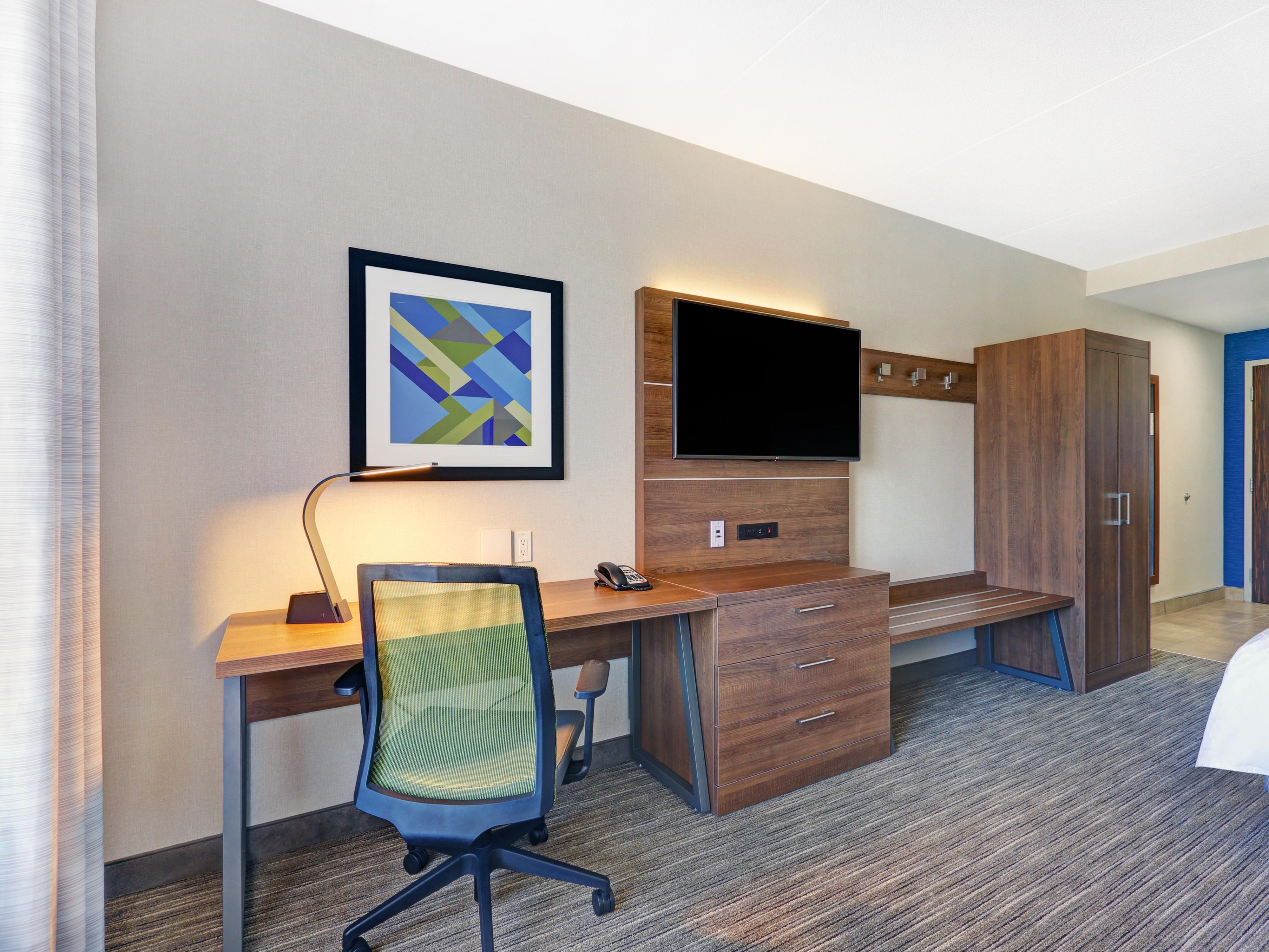 50 inch TV and large desk in all Guestrooms and Suites