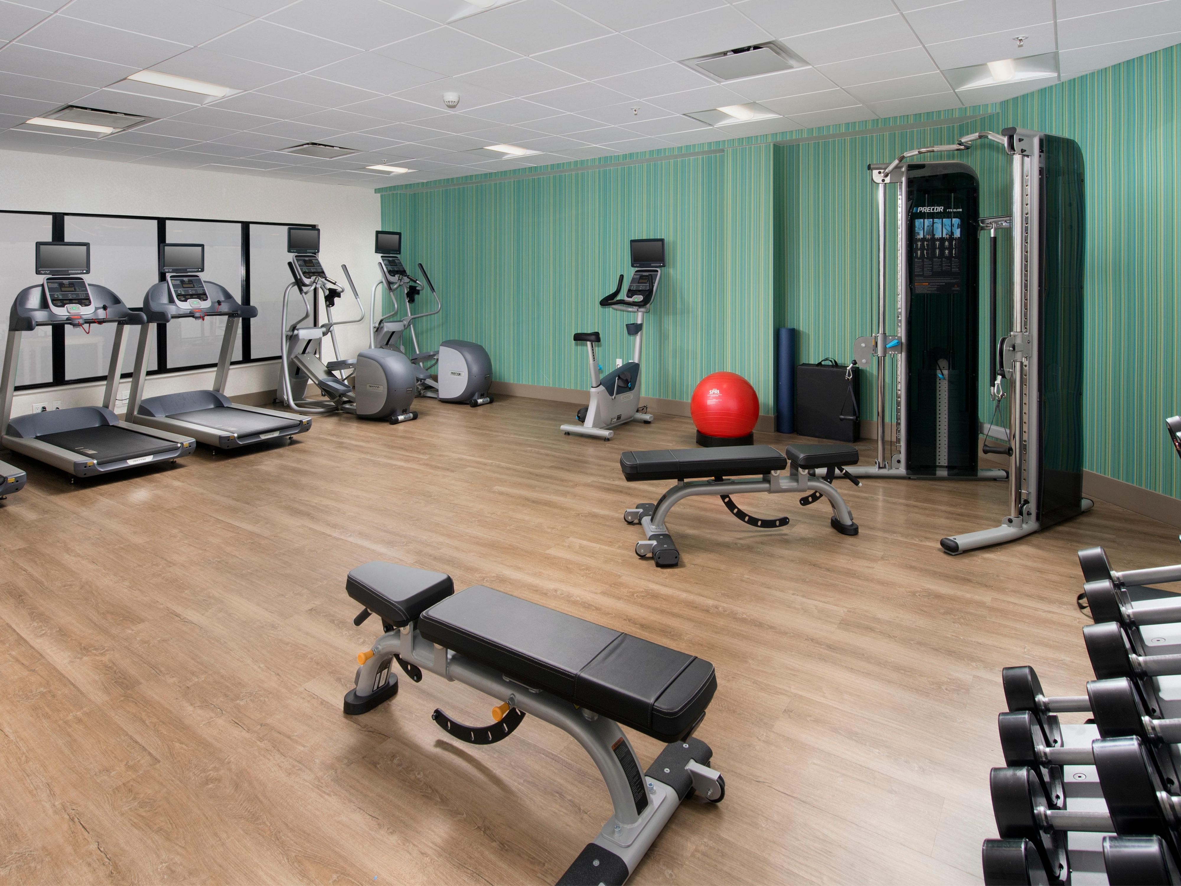 Stay energized during your travels at our new hotel fitness center, featuring a full range of equipment including free weights, cardio machines with individual screens, and modern weight machines. Maintain your wellness routine and feel refreshed with access to everything you need for a complete workout, available at your convenience.