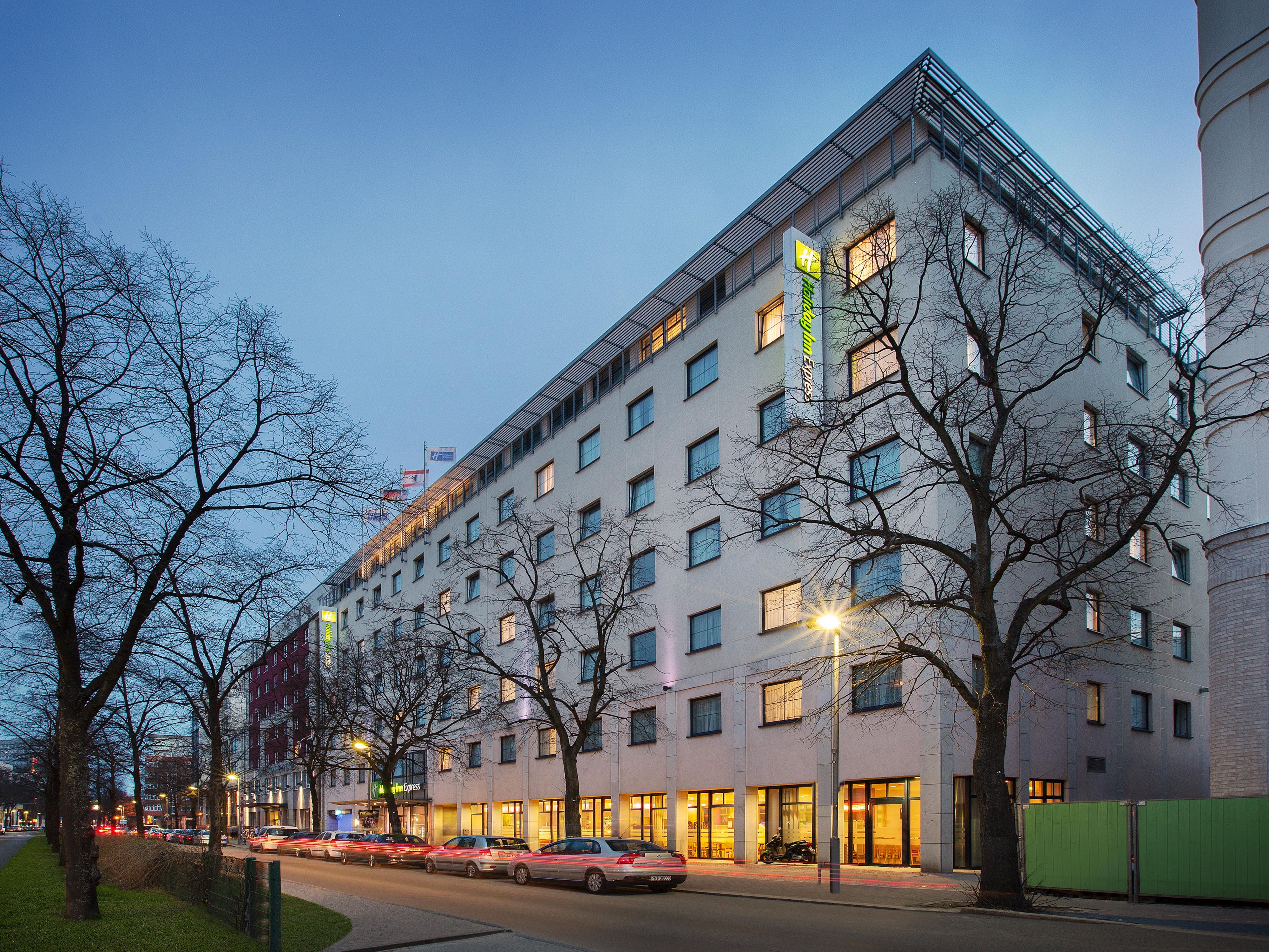 Holiday Inn Express on a broad, tree-lined boulevard in Berlin.