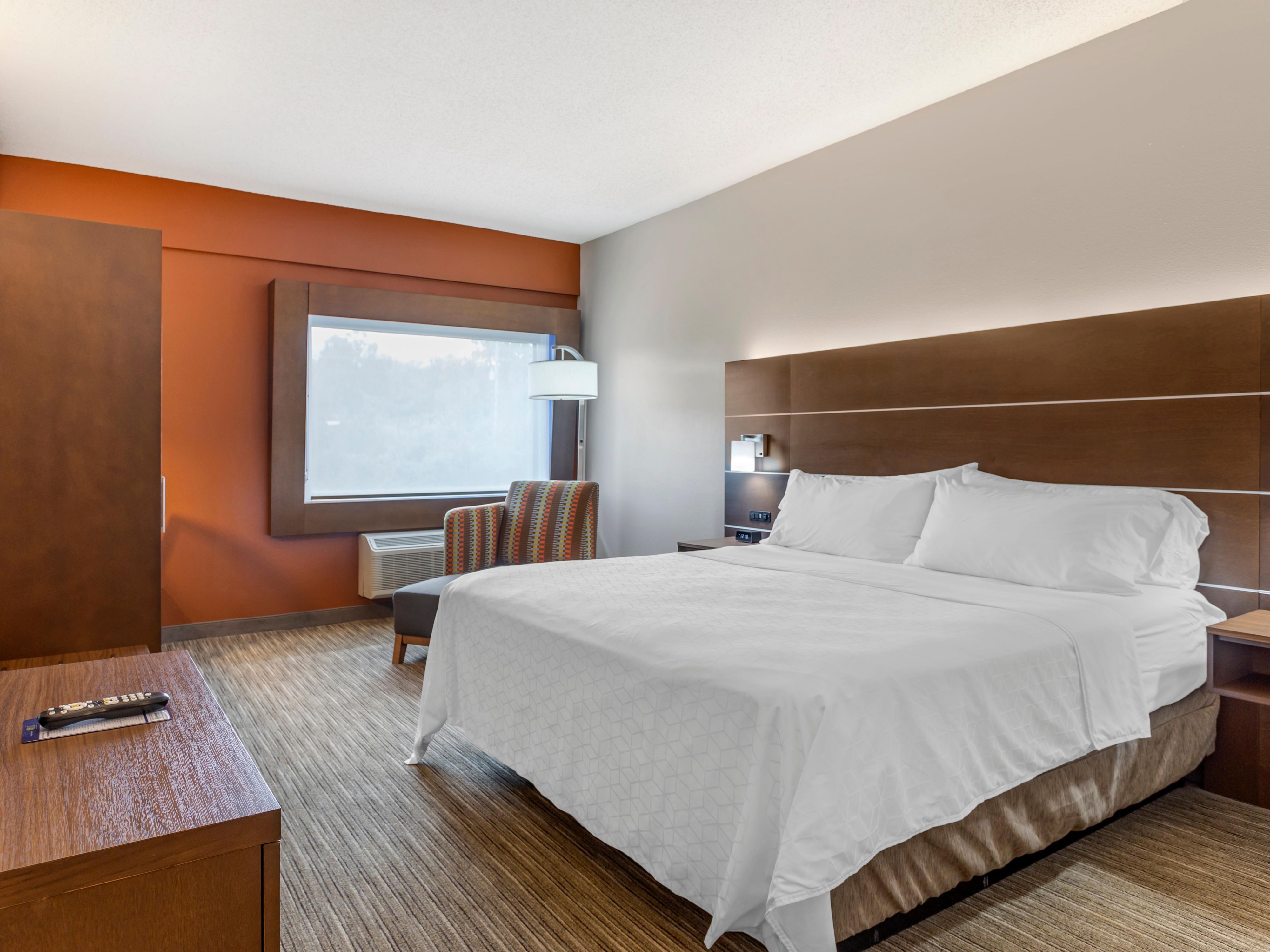 For extra space, book our comfortable king bed with chaise lounge.