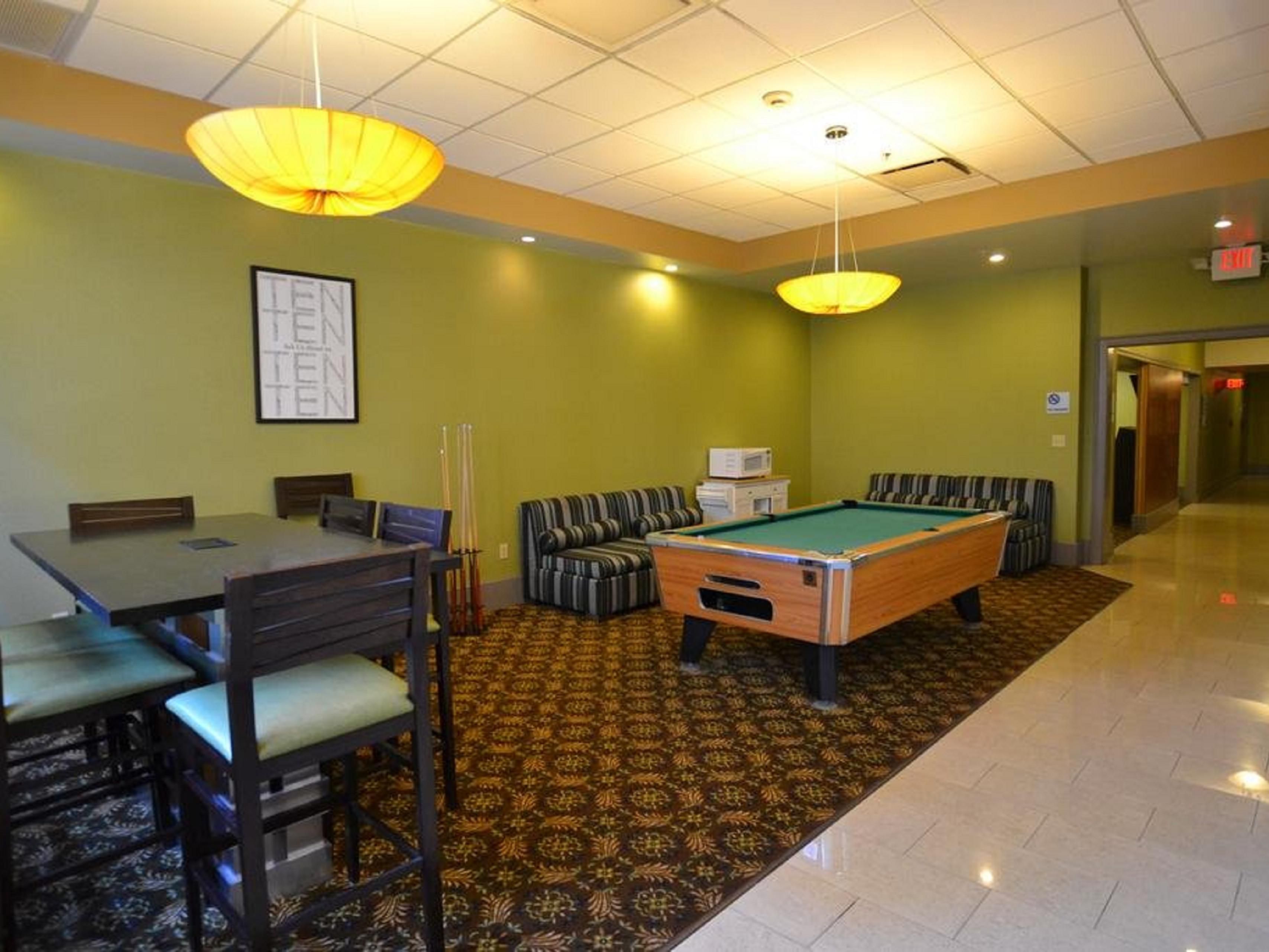 Play a round of pool with close friends.