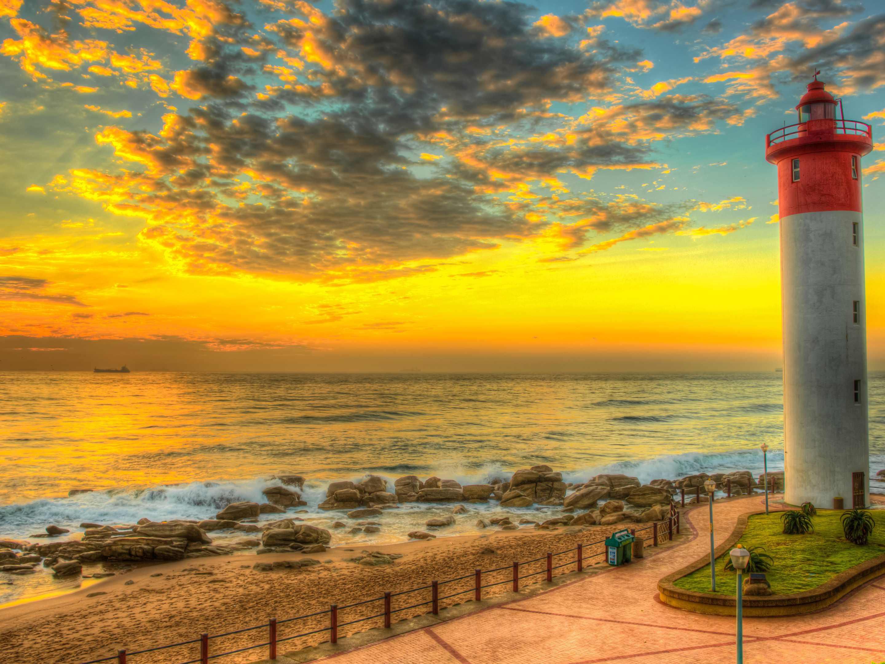 Enjoy a 2.5 km walk along the Umhlanga Promenade, featuring the iconic Umhlanga Lighthouse and Whalebone Pier. Ideal for jogging and cycling, the shaded promenade offers benches for rest and breathtaking views. Perfect for relaxing and enjoying the beauty of the coastline, making it a great spot for outdoor activities.