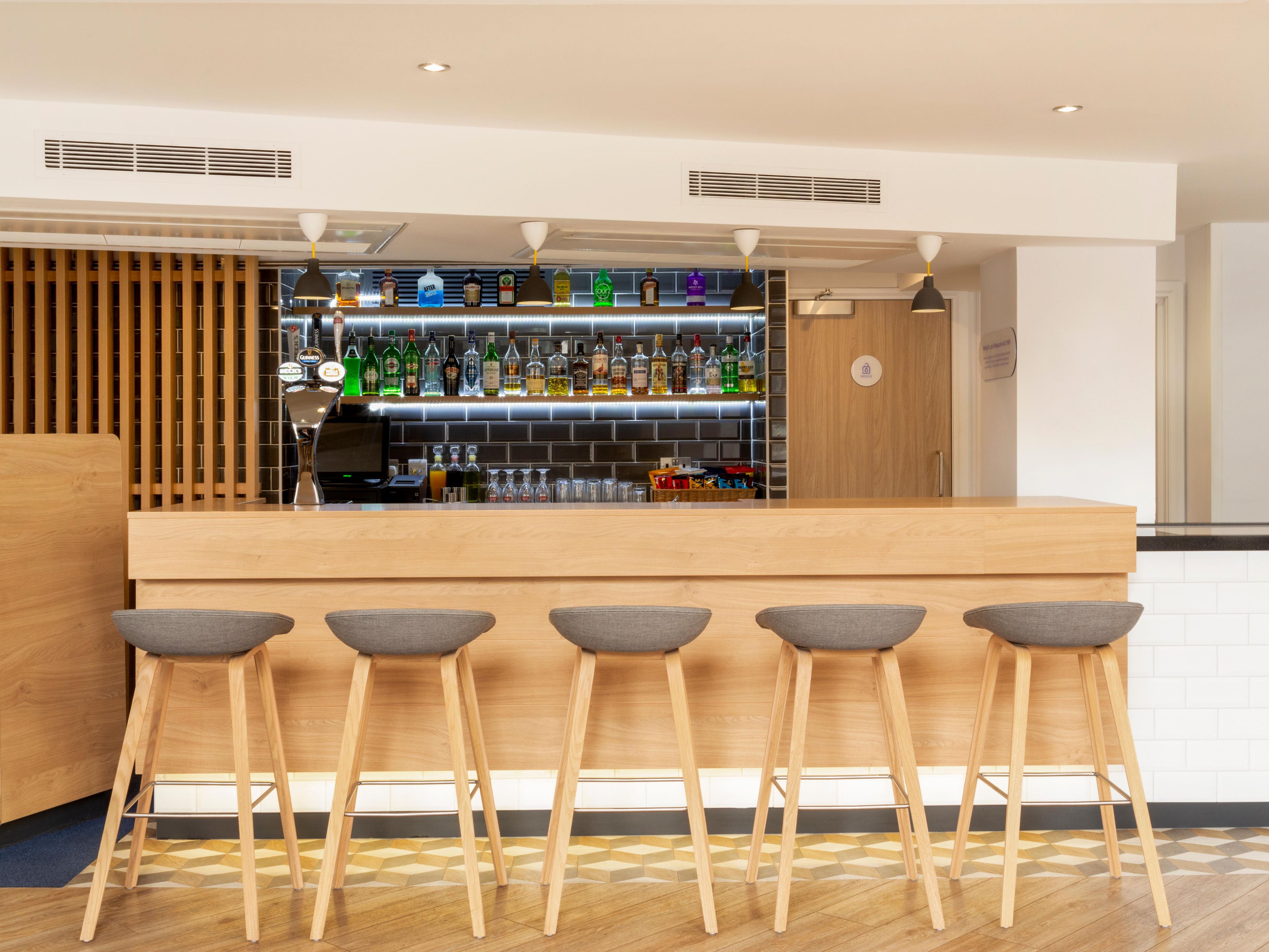 Enjoy a drink or a snack with friends in the stylish lobby bar. 