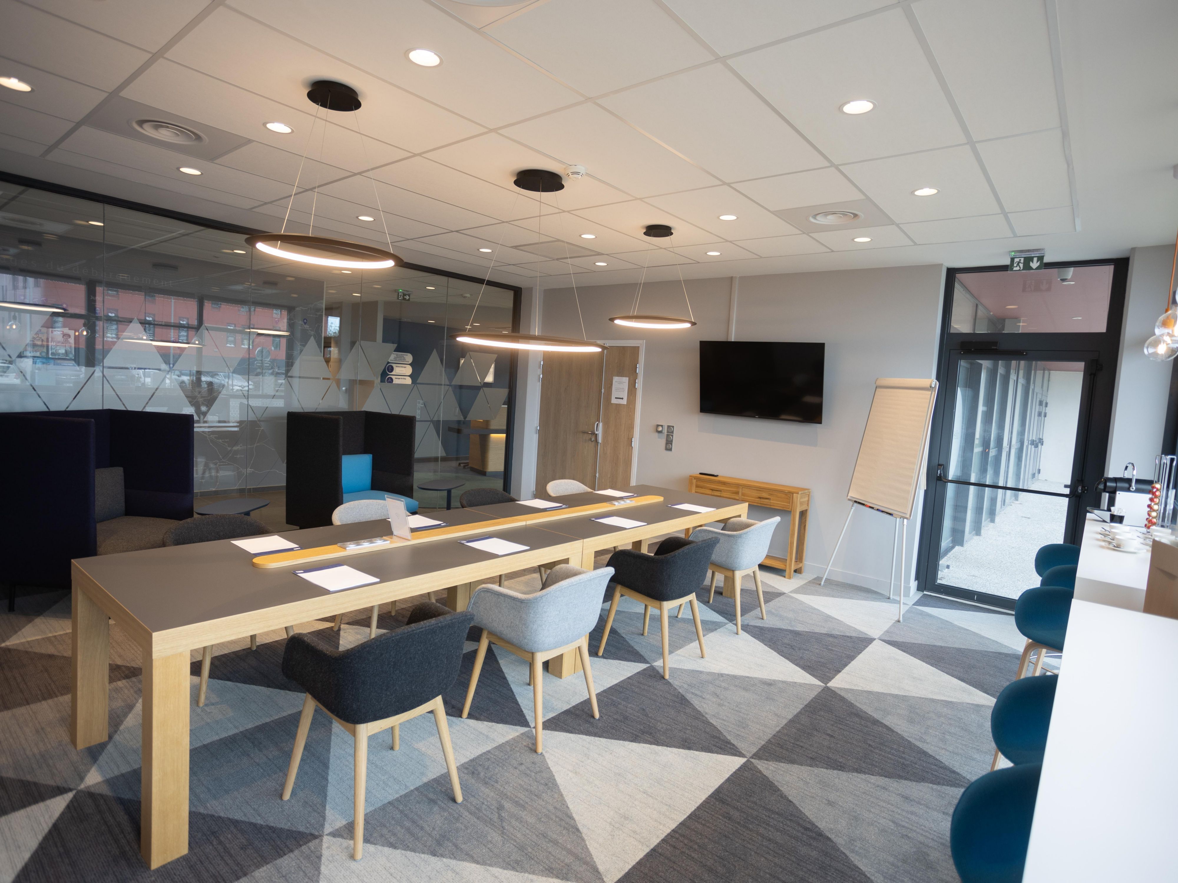 Our hotel has a natural light meeting room able to welcome up 18 people with free high-speed Wi-Fi. It has a big TV Screen to display your presentation. We can include morning coffee and sweety breaks.