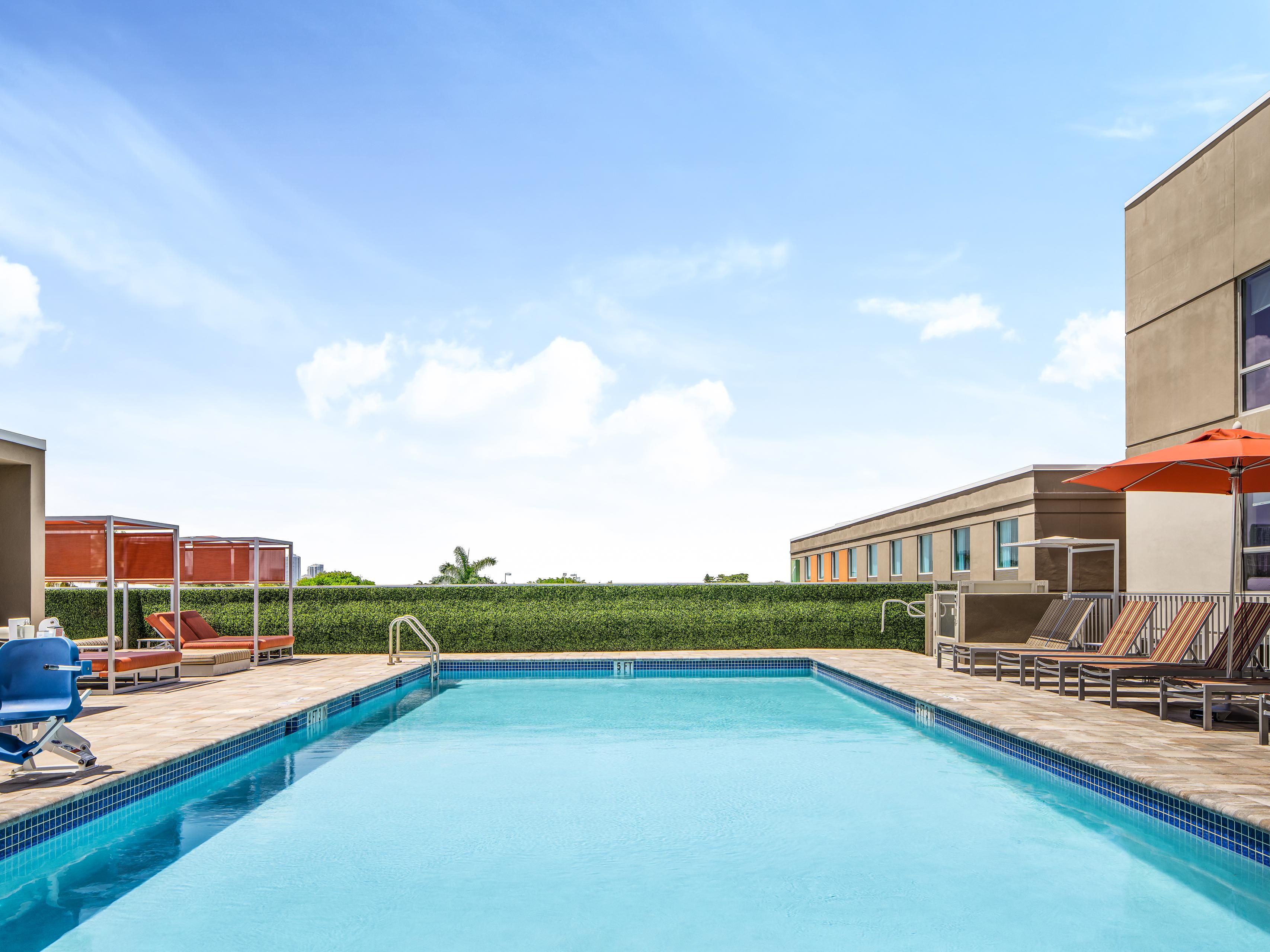 Relax and unwind at our beautiful outdoor rooftop pool, offering stunning views of Fort Lauderdale. Open daily from 7:00 AM to 7:00 PM, this serene spot is perfect for a refreshing swim or a quiet retreat after a long day. Enjoy the Florida sunshine and take in the scenic surroundings while you soak up the peaceful atmosphere.