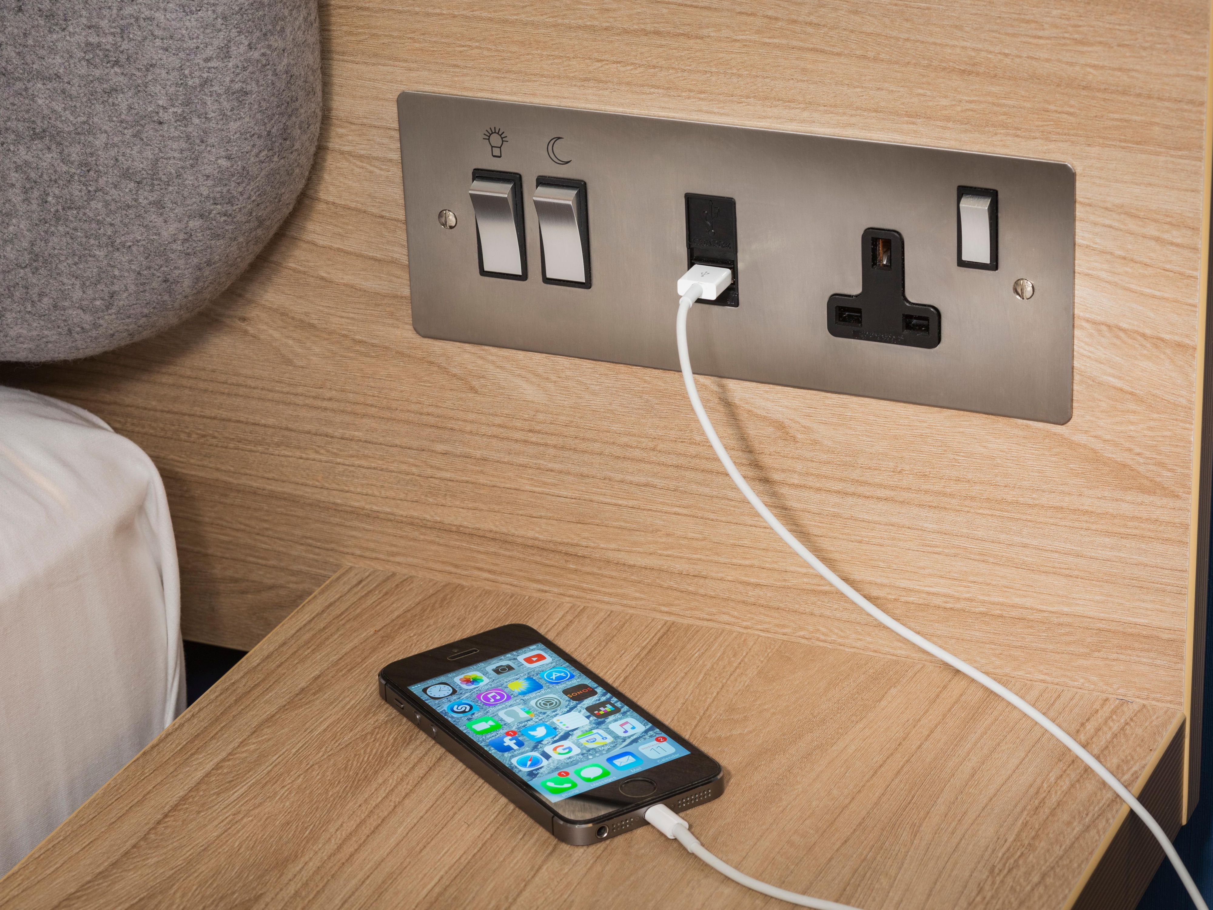 access one of our nifty USB ports right beside your bed