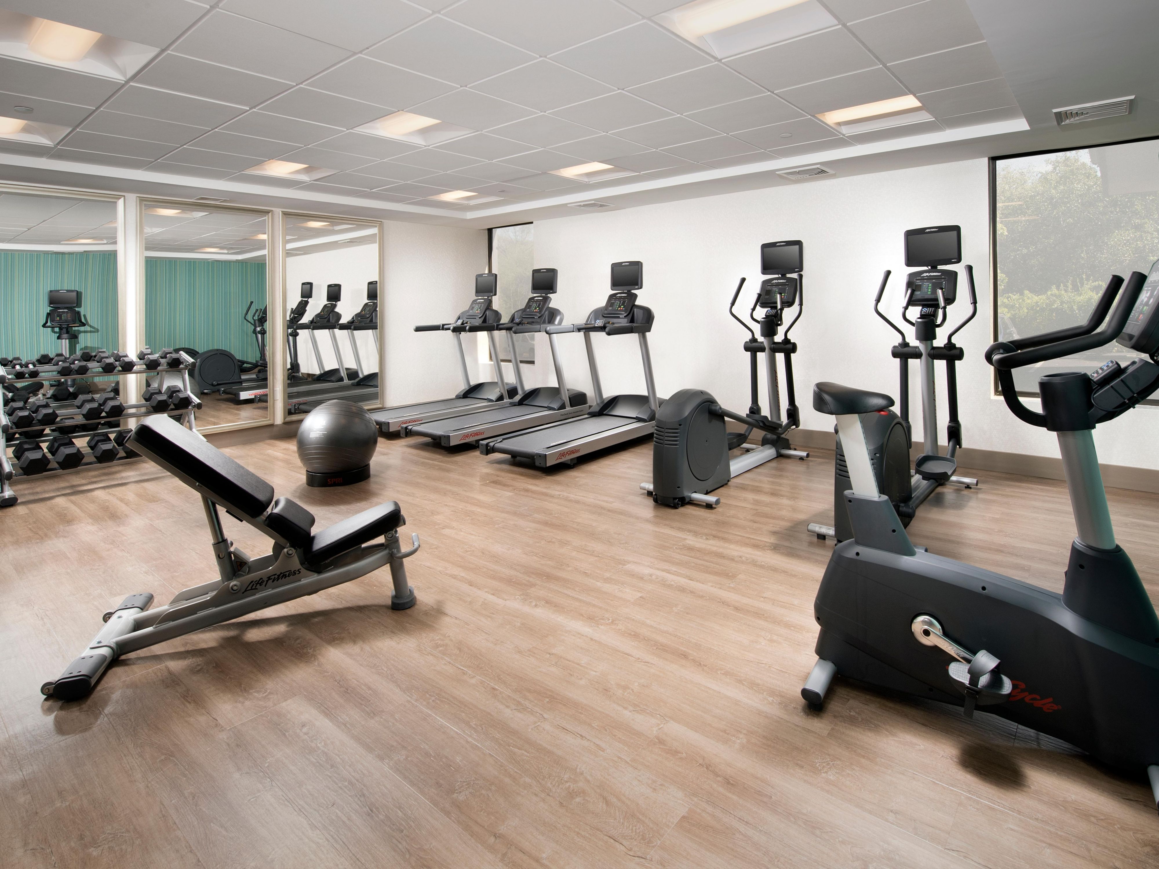 On site fitness center opened 24 hours a day. All the equipment you need including treadmills, bicycle, and elliptical. TVs located on the stationary machines. 