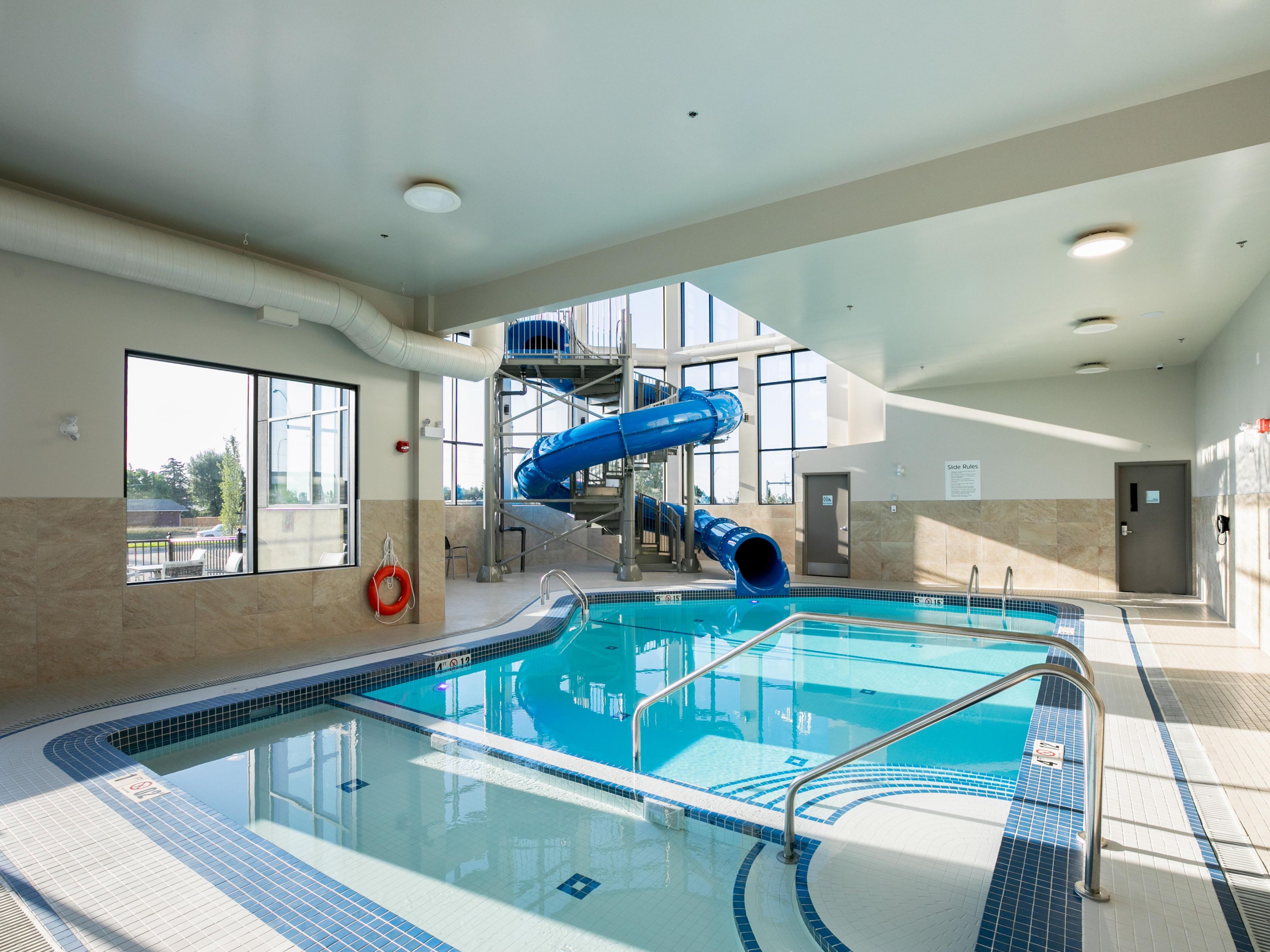 Bright and spacious, this area has something to offer for the whole family. Toddler wading area just off the main pool. The pool also features a waterslide for everyone to enjoy.