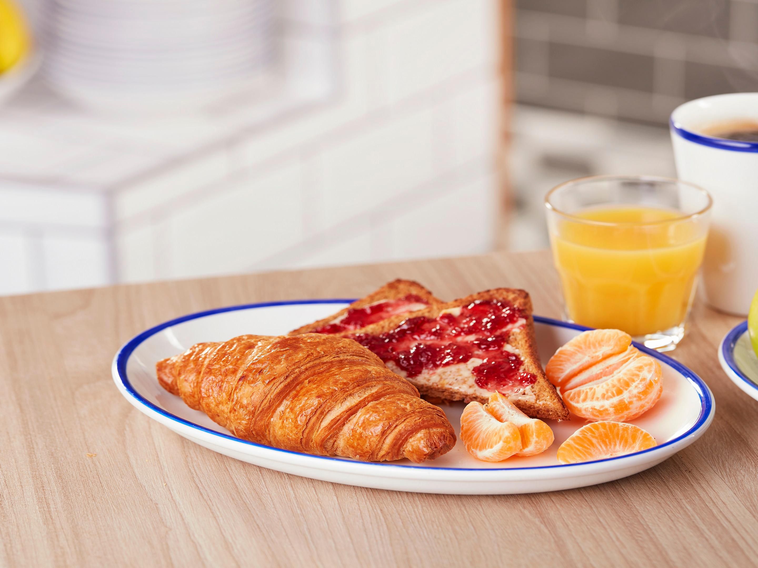 Start the day with the Free Breakfast buffet served in the Great Room, including a spread of fresh pastries and cereals, plus baked beans, tomatoes, hash browns, bacon, scrambled eggs and sausages.