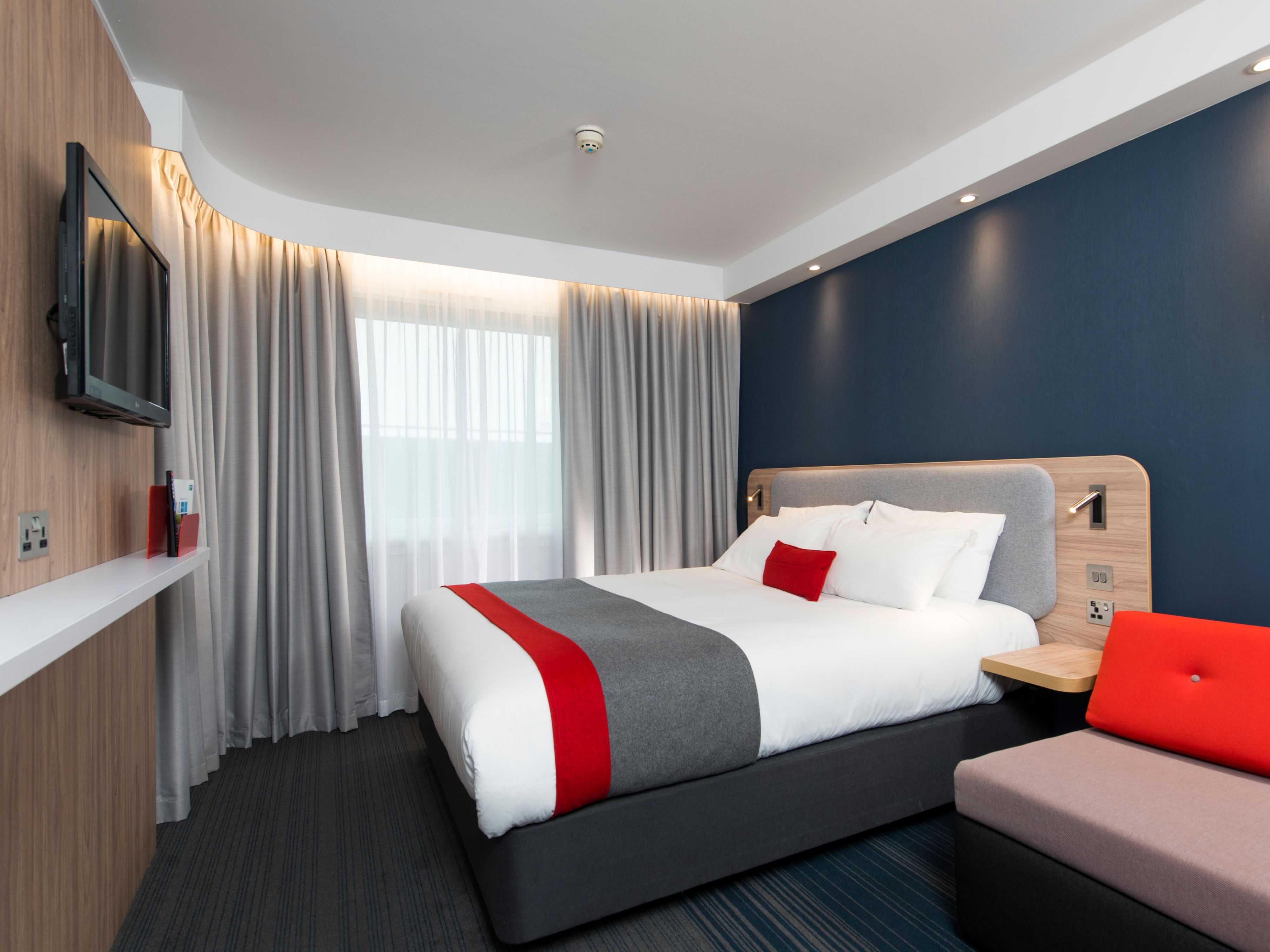 Watch your favourite shows on the wall-mounted TV with Freeview