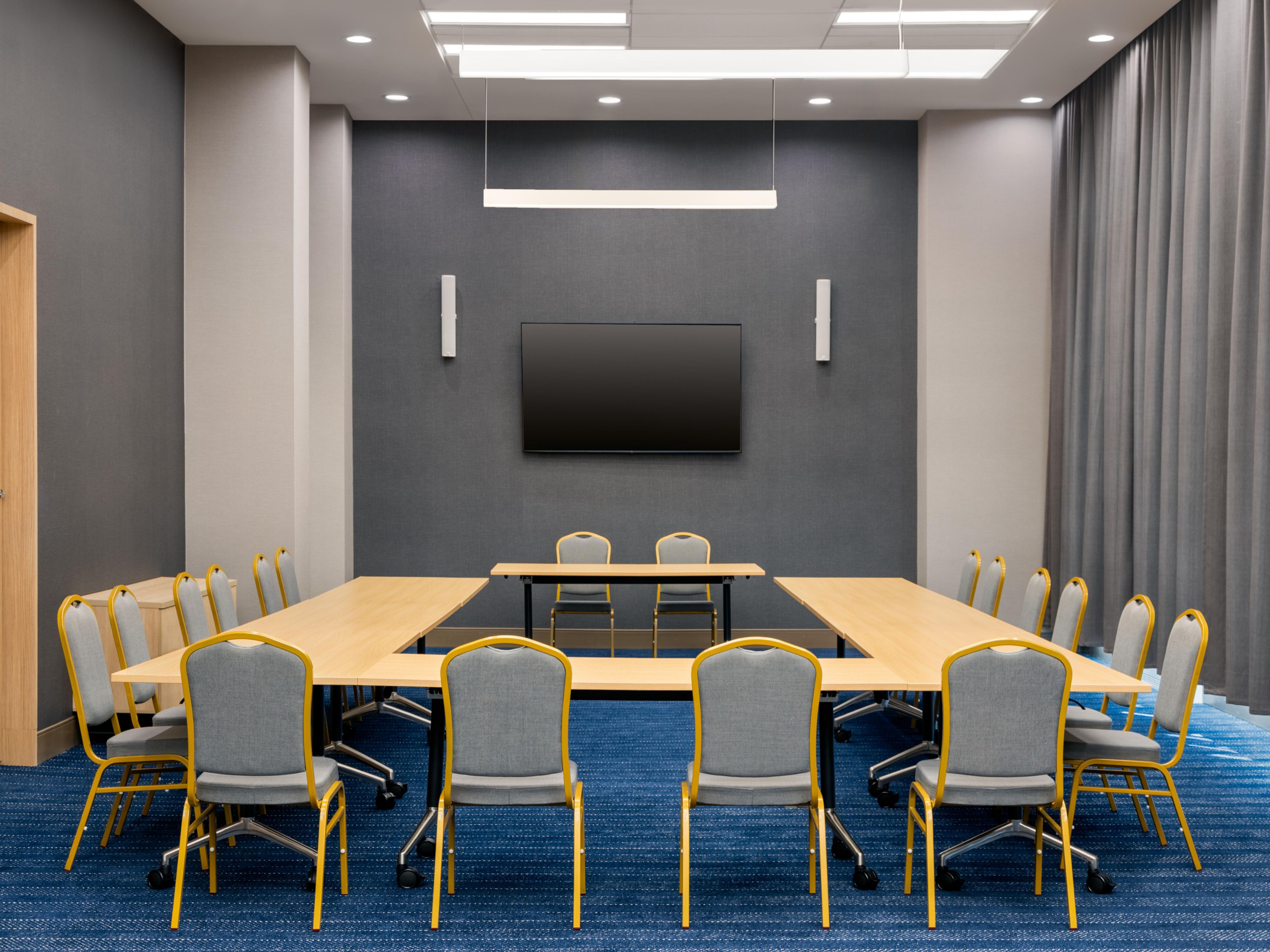 Our versatile meeting room offers over 1,000 sq. ft. of space, perfect for corporate meetings, conferences, and social gatherings. Enjoy ample natural light from floor-to-ceiling windows, creating an inspiring atmosphere. Enhance your event with customizable setups and tailored catering options. Contact us for meeting packages and availability!