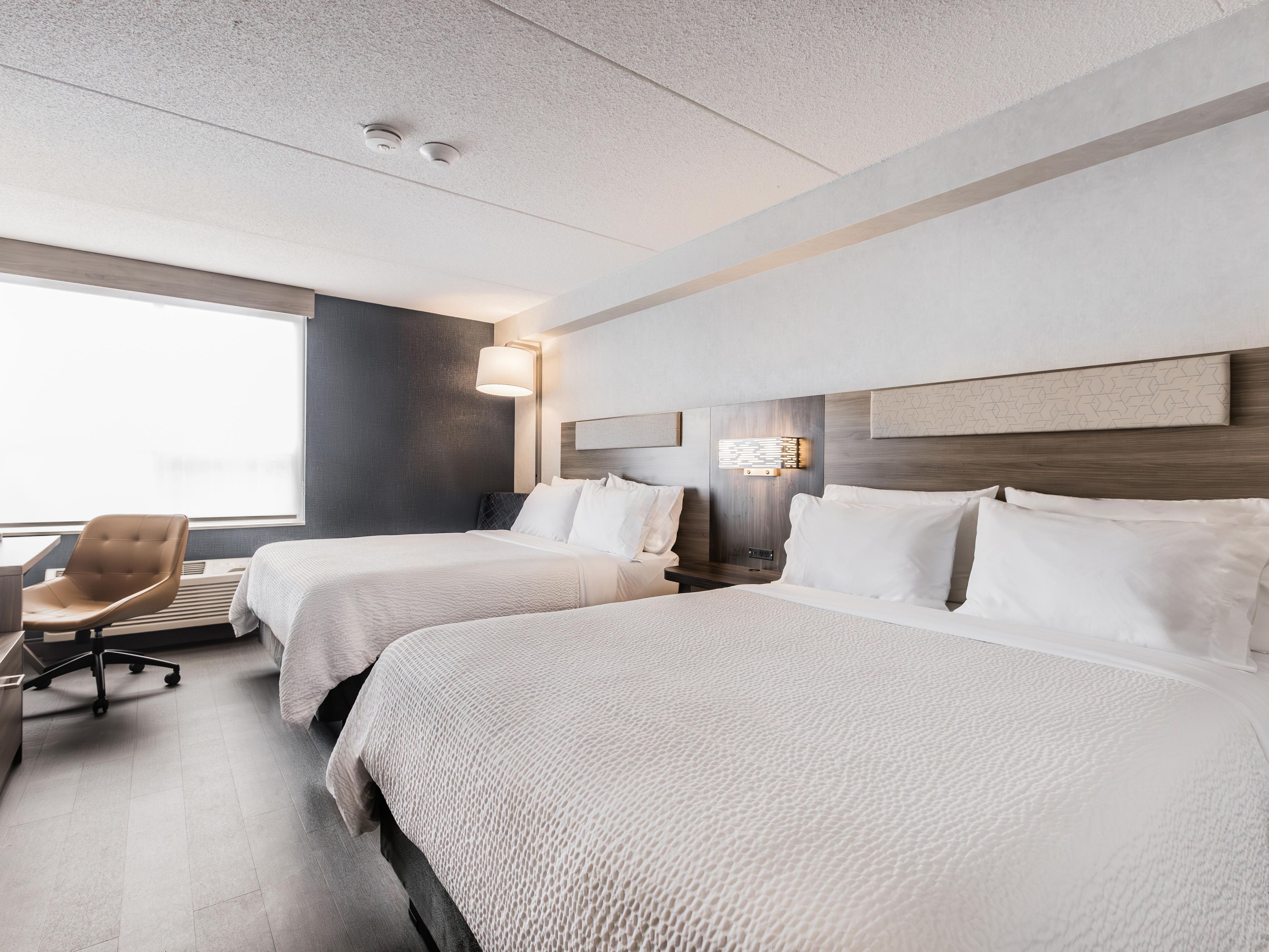 Experience ultimate comfort in our newly refreshed guestrooms, designed with your relaxation in mind. Each room features plush bedding, a work desk, a flat-screen TV, fridge, microwave & a coffee maker to keep you comfortable throughout your stay. Our modern design and thoughtful amenities create the perfect environment for a restful night’s sleep.