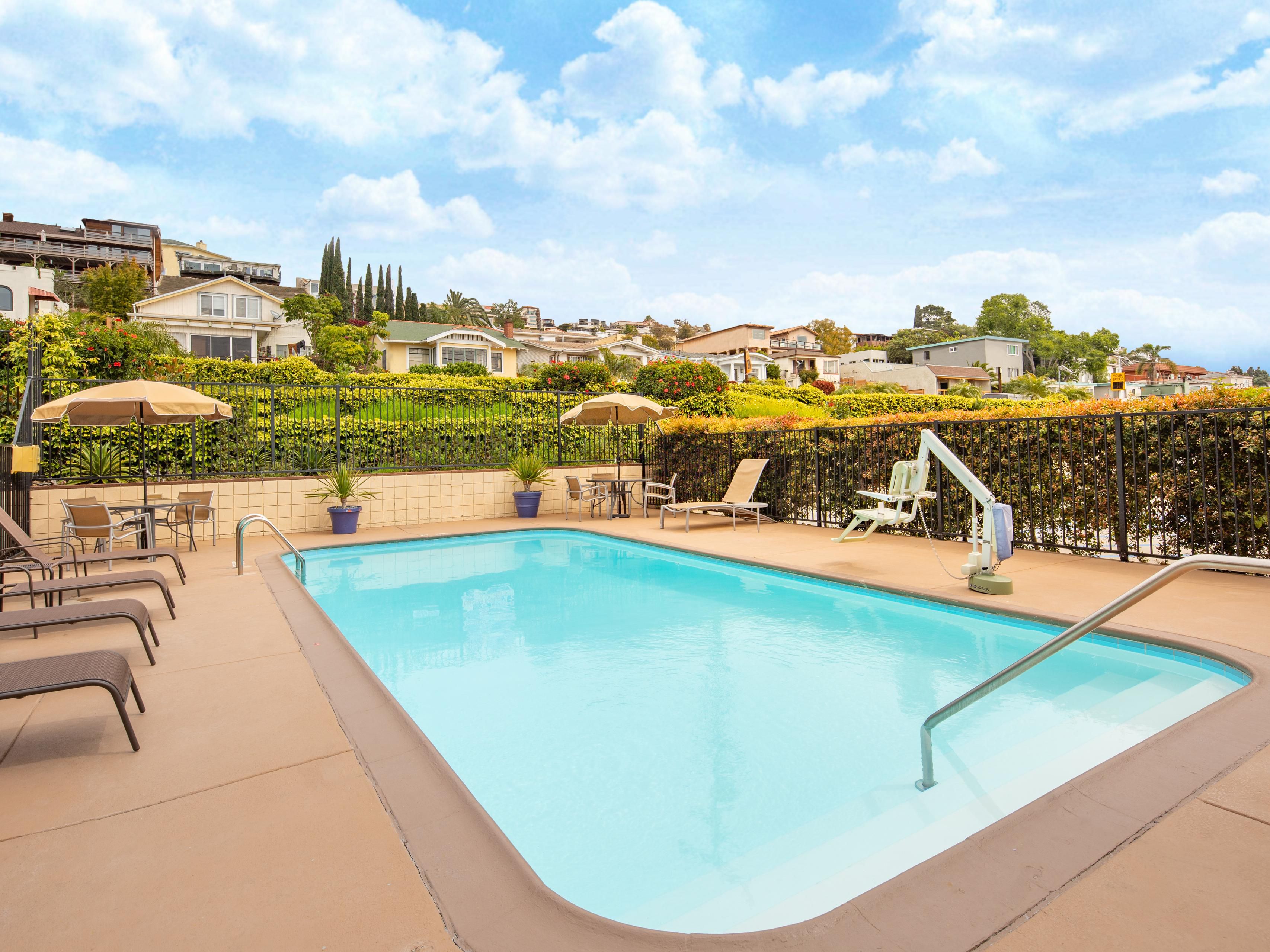 Relax by the outdoor heated pool after your long flight to San Die