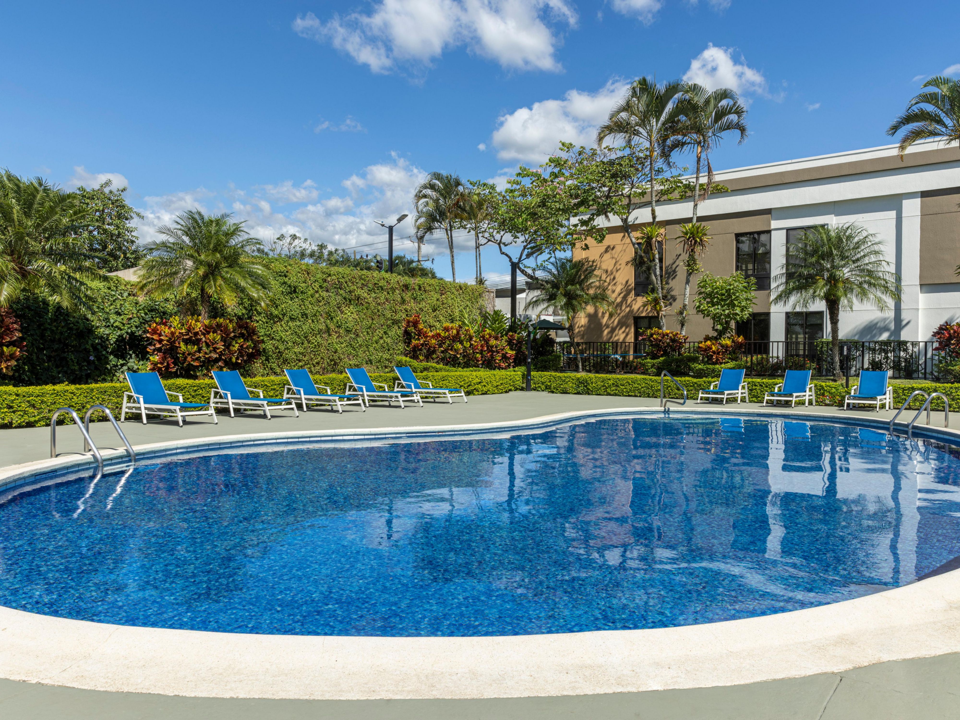 Take a refreshing dip in our inviting outdoor pool, the perfect hotel for relaxation during your stay. Open from 8:00 AM - 10:00 PM, it gives ample time to enjoy a leisurely swim or simply unwind in the sun poolside. Lounge beneath the swaying palm trees and soak up the Alajuela sunshine in the tranquil tropical surroundings.