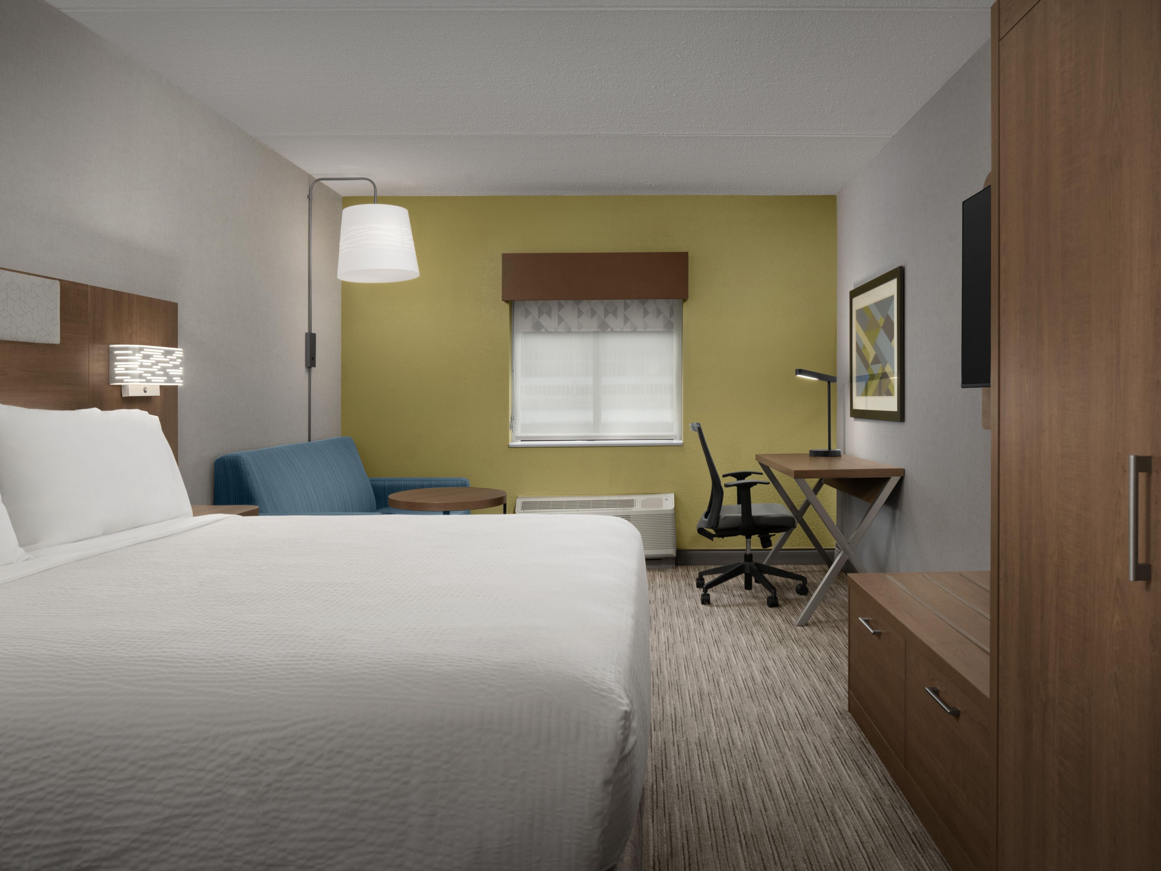 This king bed guest room features a sleeper sofa.