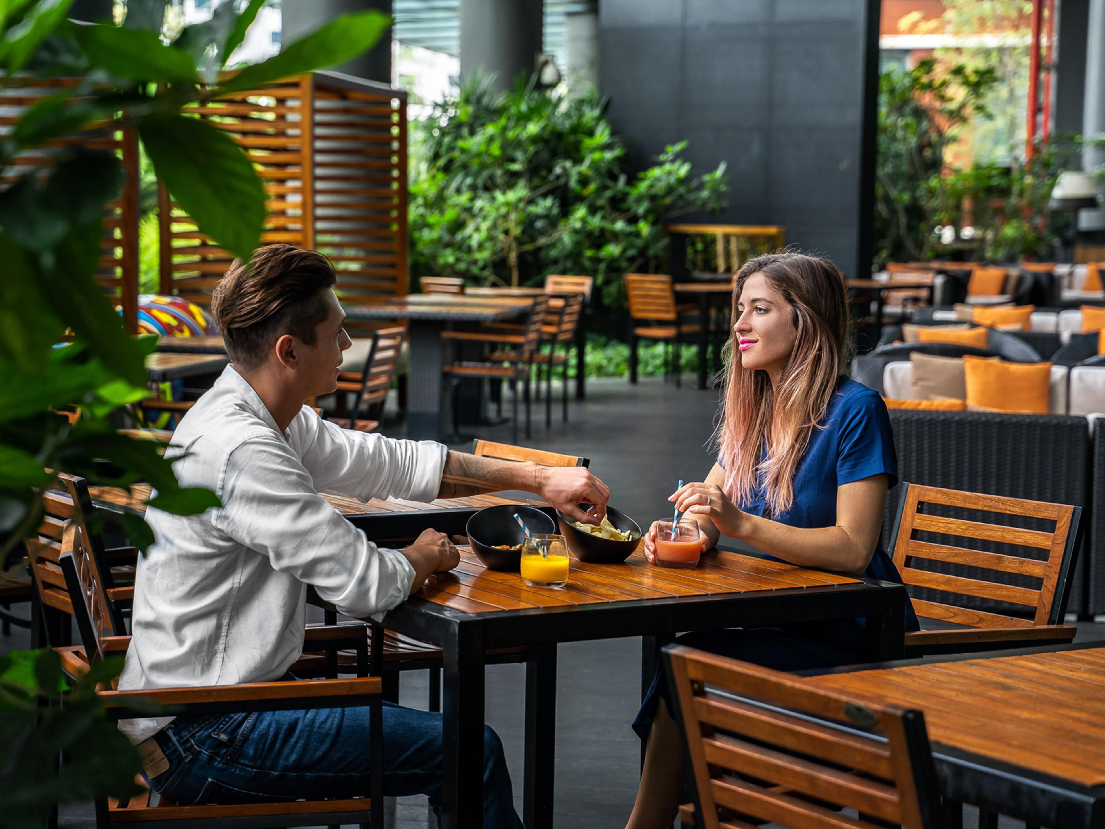 A multi-purpose outdoor space filled with lush greeneries and comfortable cabanas seating for breakfast dining, event spaces, co-working spaces and more.