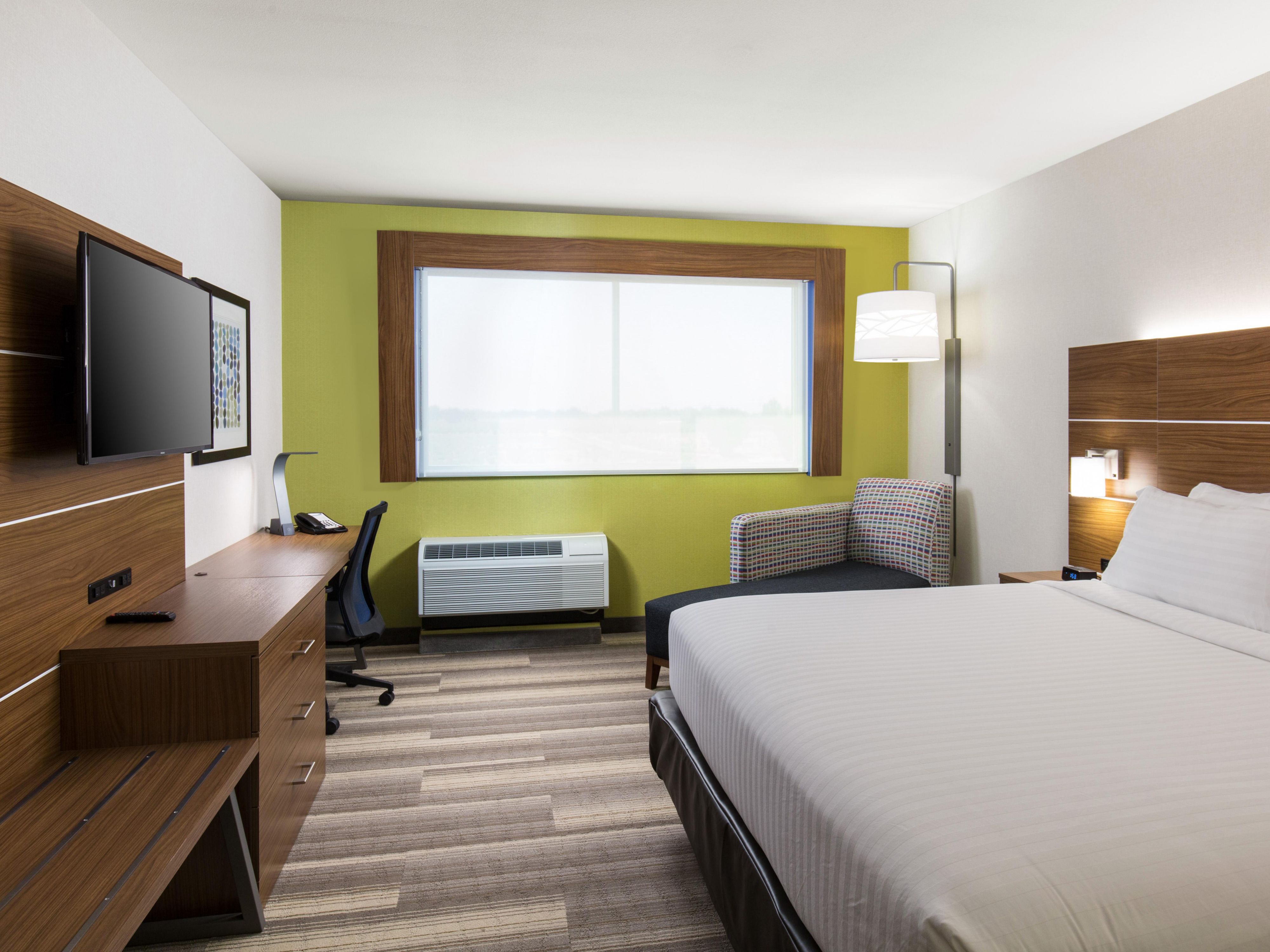 Rest comfortably in rooms with king-size bed, work desk, & TV.