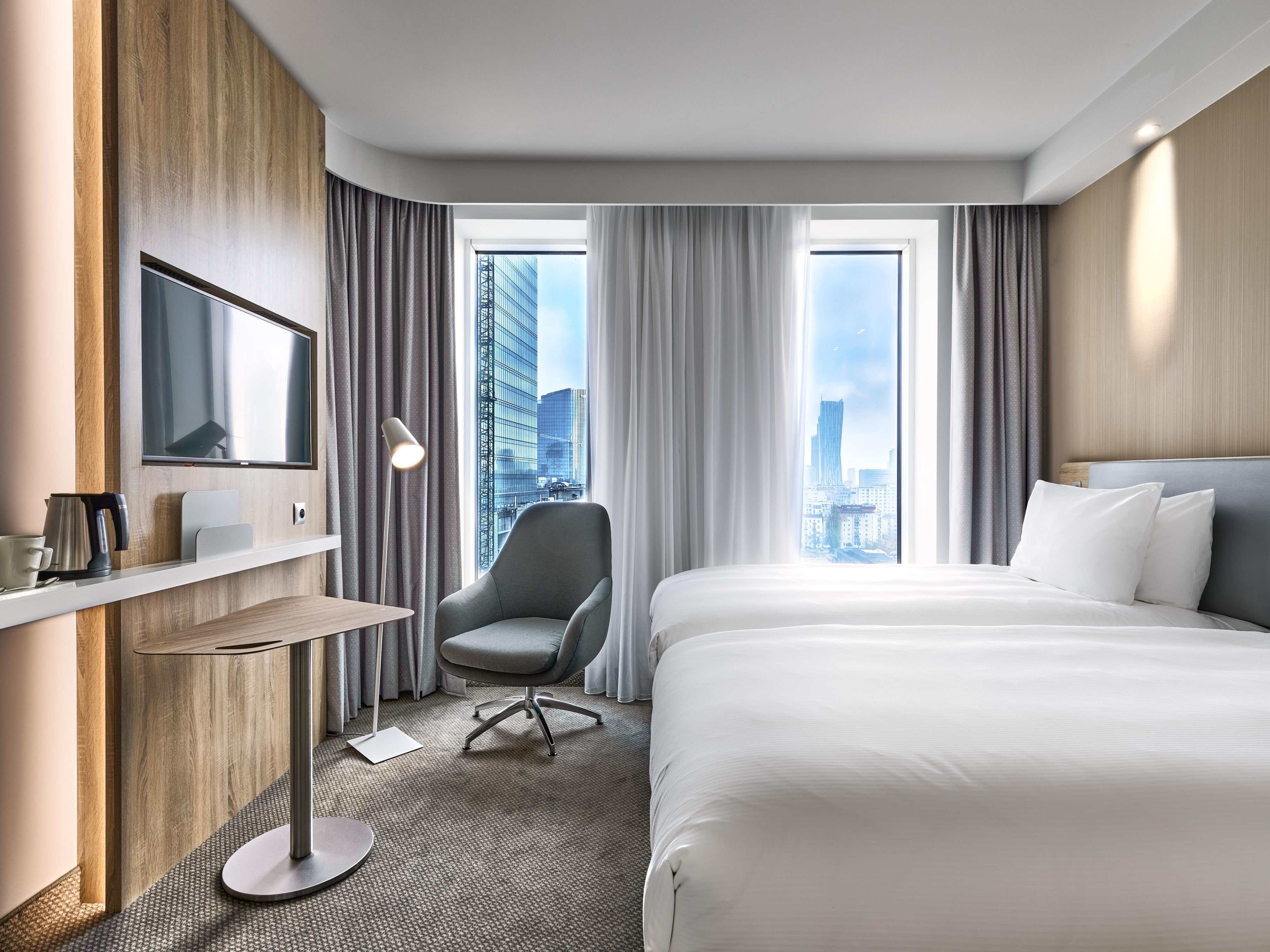 Guest Room with two separate beds and city view