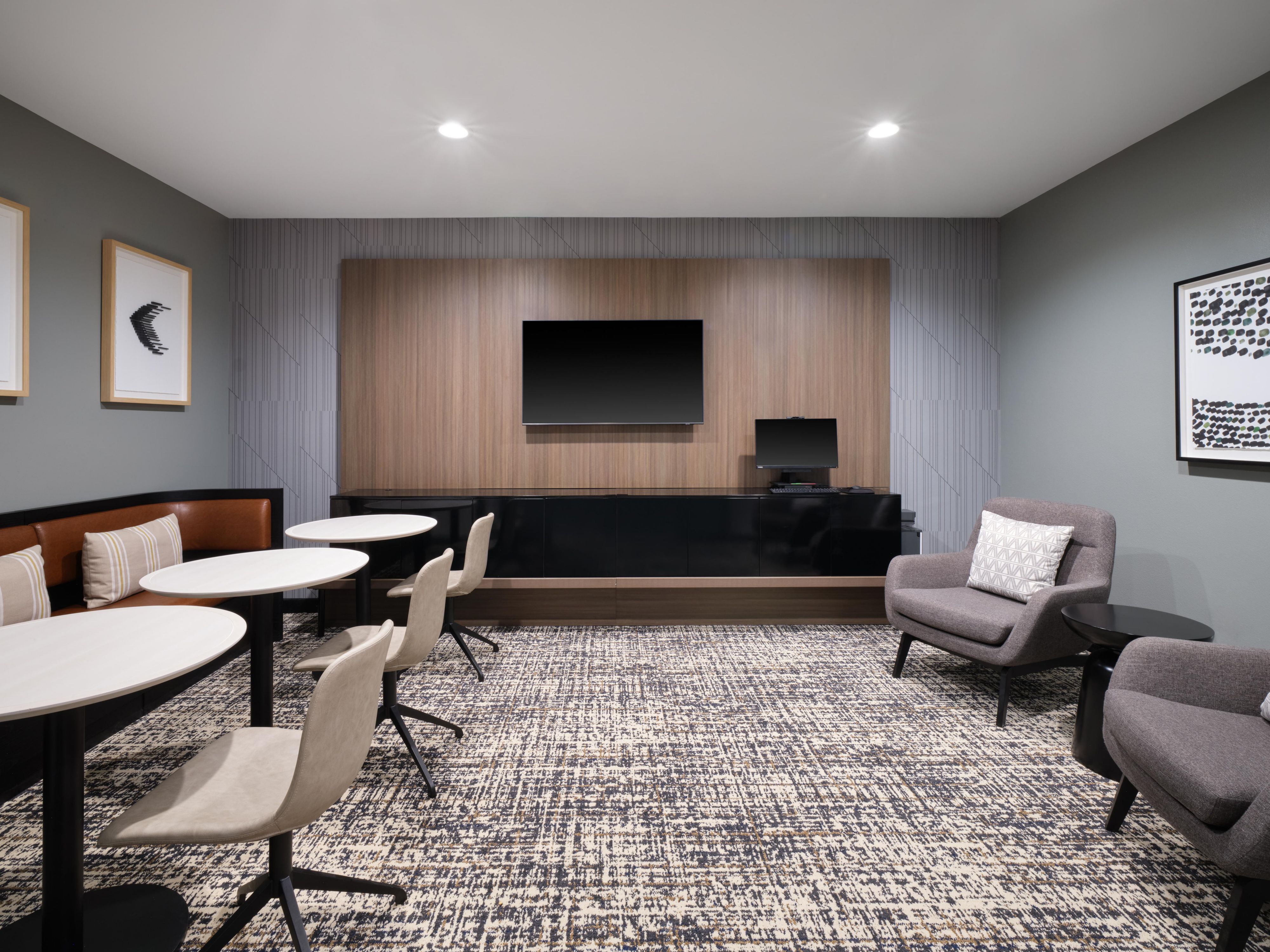 Spacious business center with multiple work areas. 