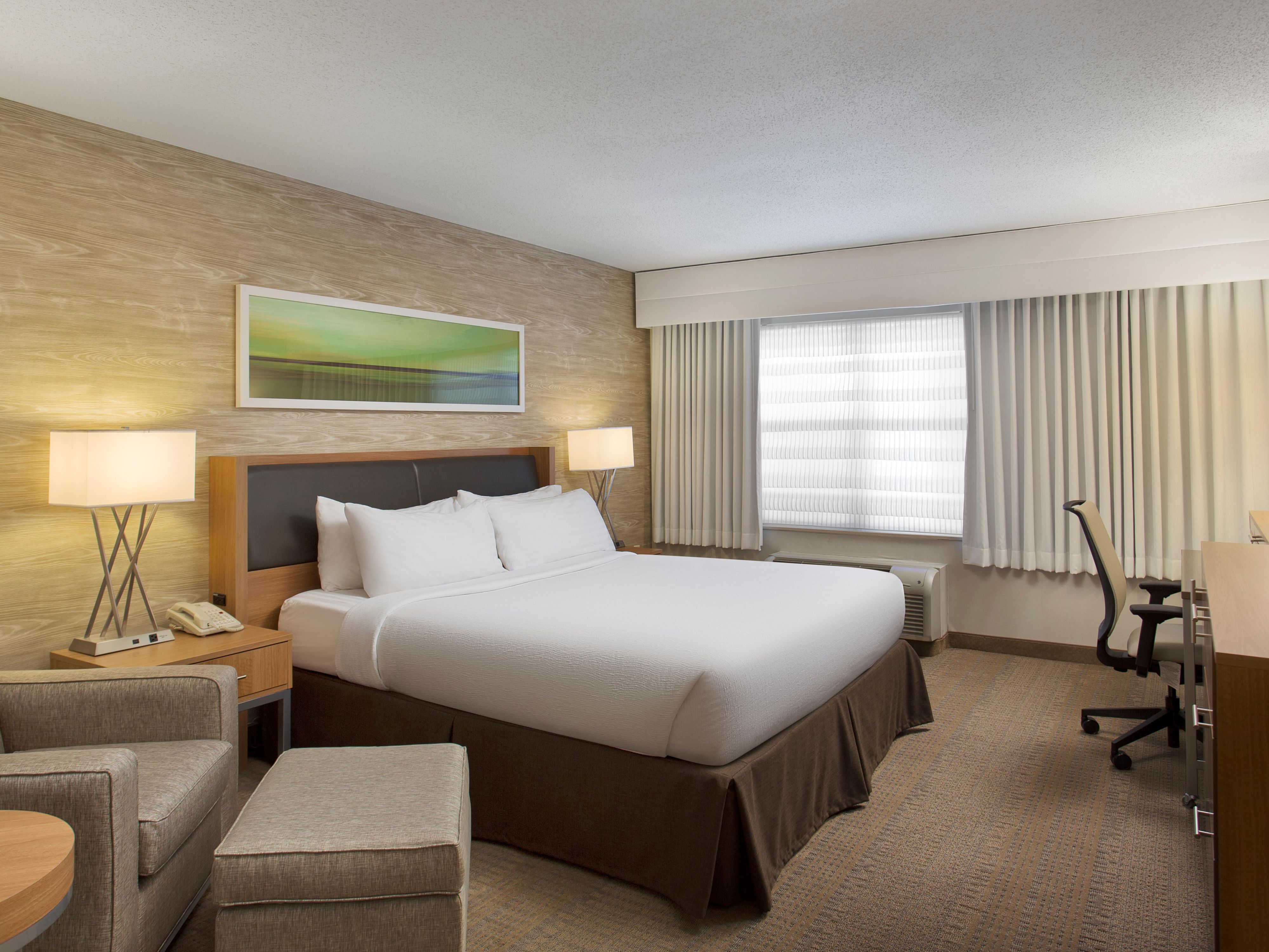 Cozy up in a king bed at the Holiday Inn Grand Rapids - Airport.