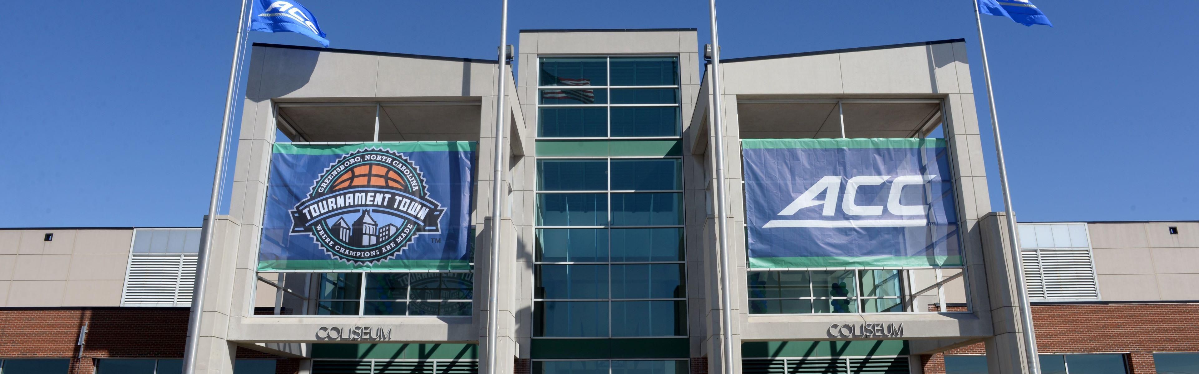 Exterior of the Greensboro Coliseum with large ACC banners.