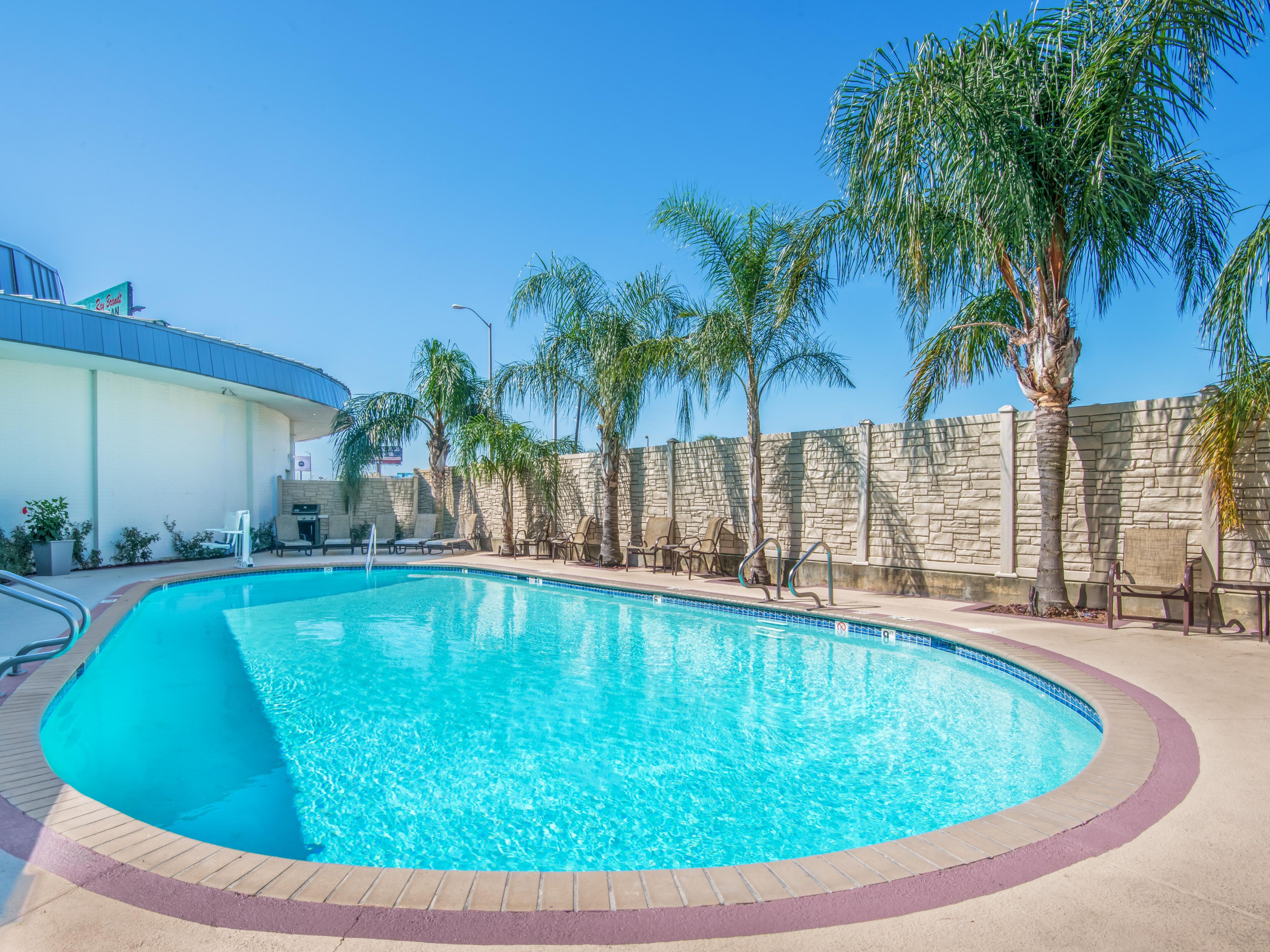 Our outdoor pool is the perfect spot to refresh after a day of exploring. Whether you're aiming for a leisurely swim or a relaxing lounge by the water, our pool area offers a serene escape for all guests.