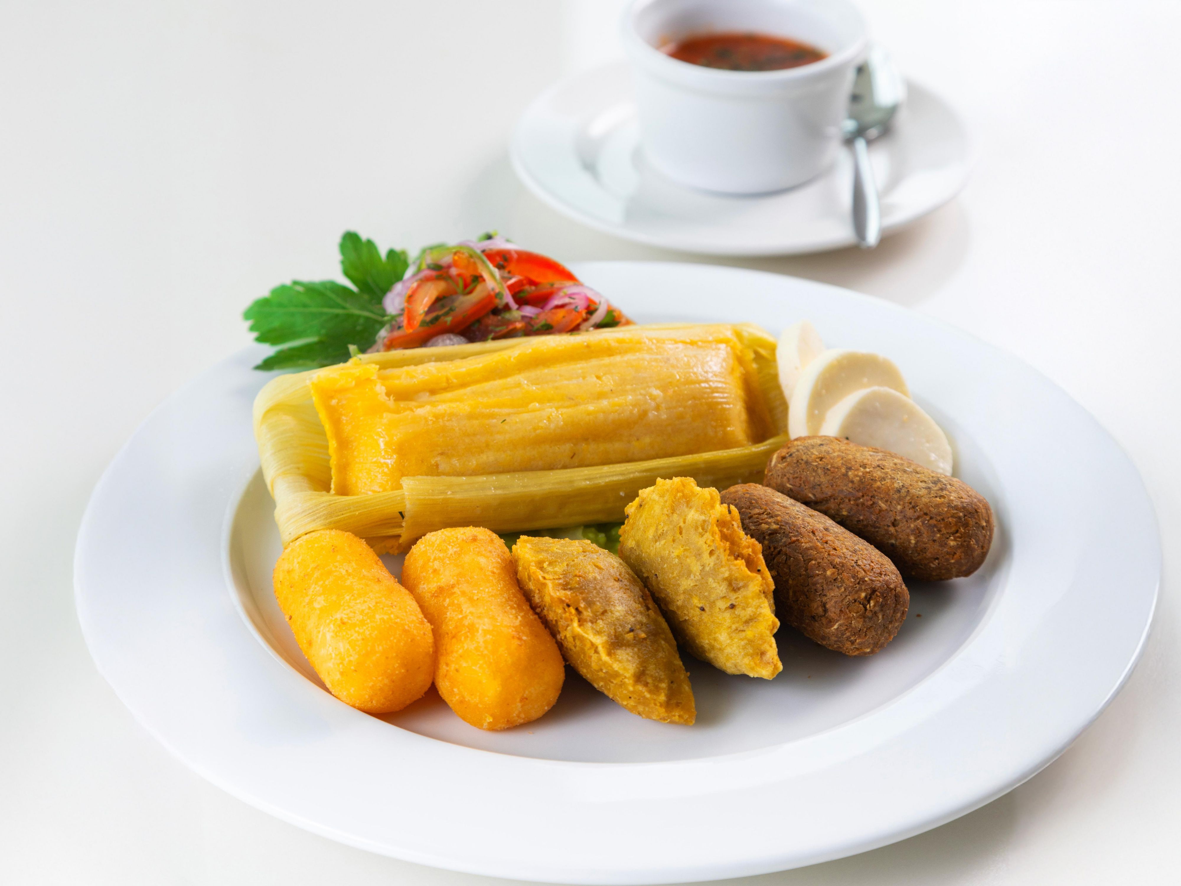 Enjoy a variety of typical Ecuadorian appetizers served with traditional chili sauce: cassava patties with cheese, cheese 'humitas' (steamed fresh corn cakes), 'corviches' (deep-fried green plantain filled with fish and peanut sauce), and green plantain empanadas stuffed with meat.

Now serving at Restaurant Connexion.