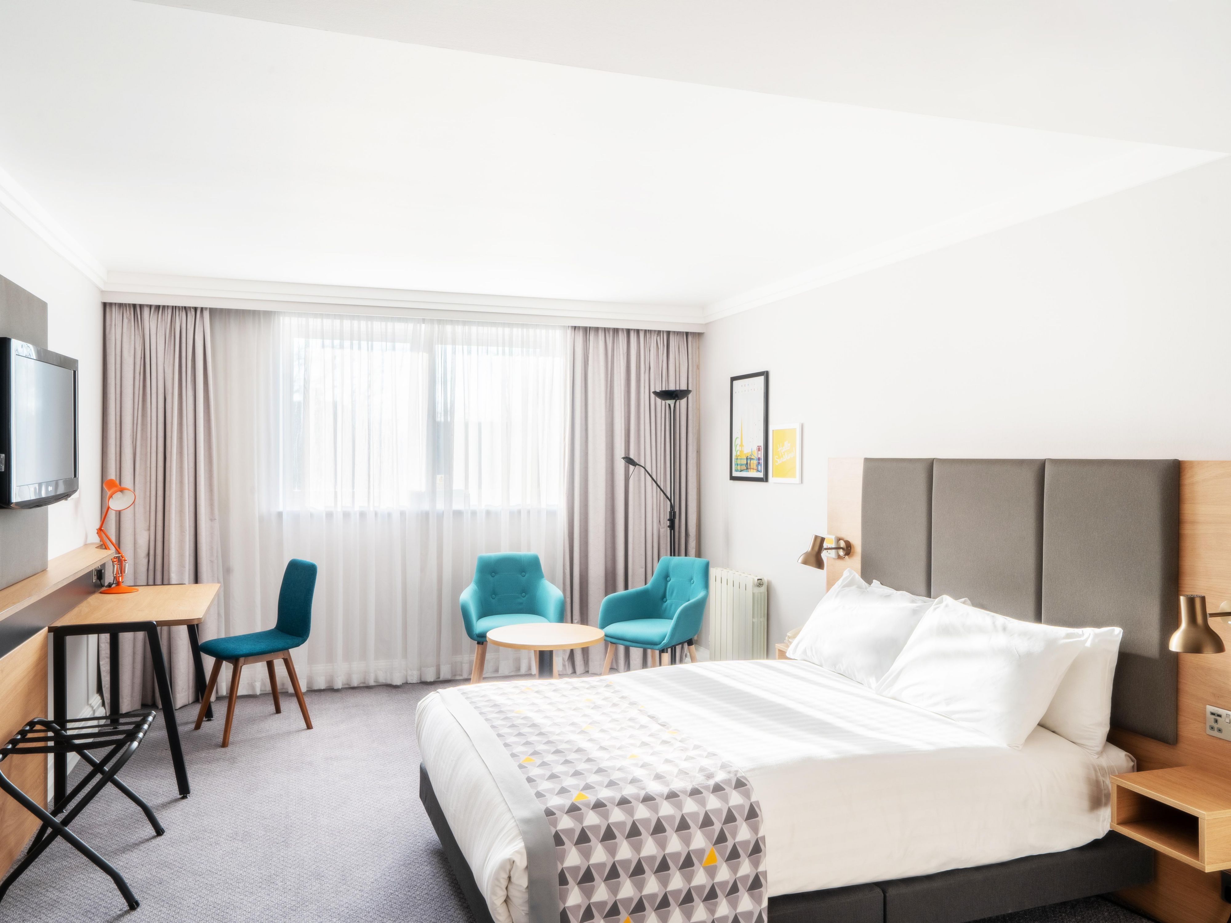Relax in our hotel room with a double bed and seating