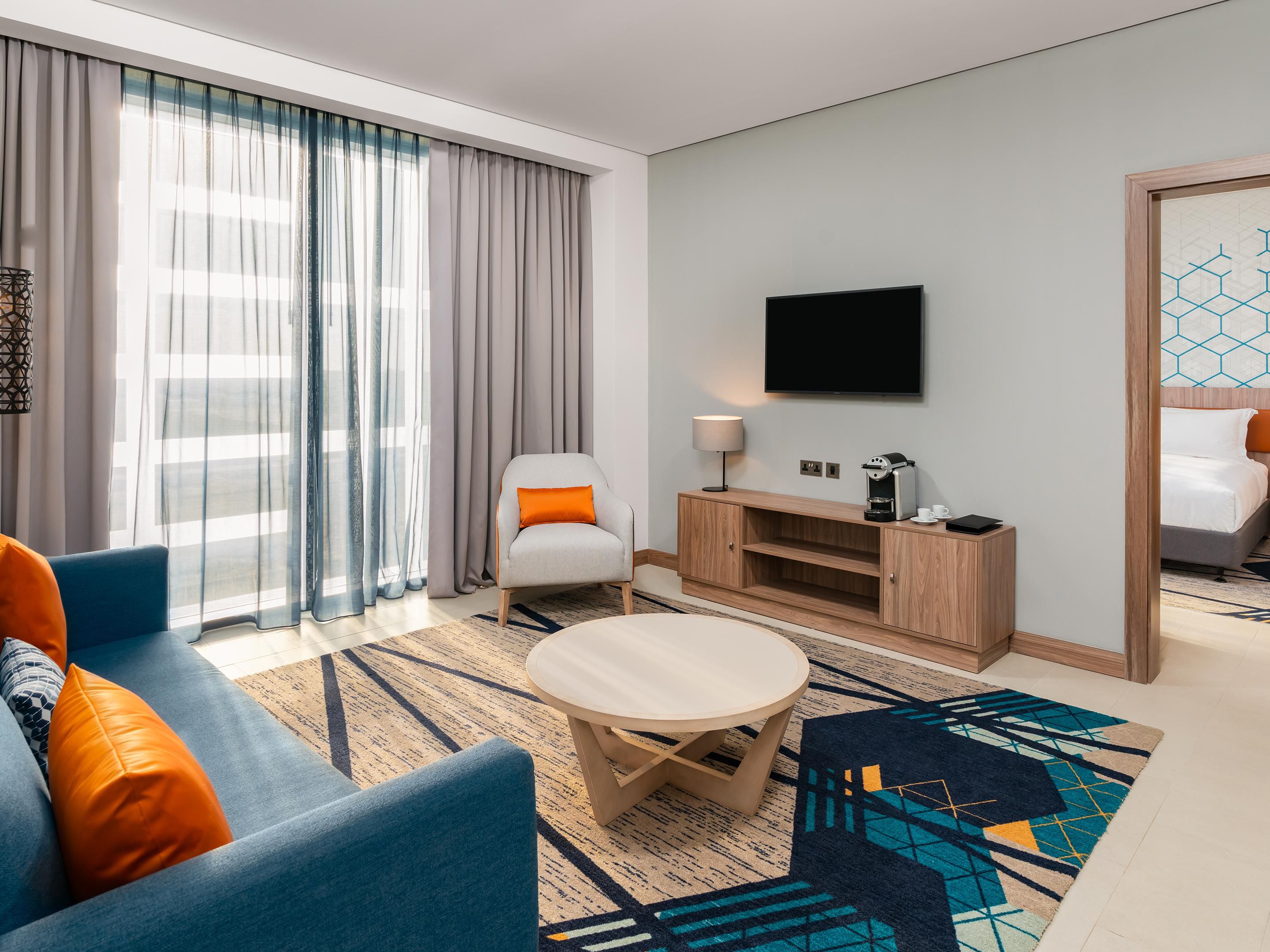 Elevate your stay to new heights with a luxurious suite.  Our elegantly designed suites offer unparalleled comfort, featuring spacious living room areas, plush bedding and modern amenities to ensure a relaxing and indulgent experience.