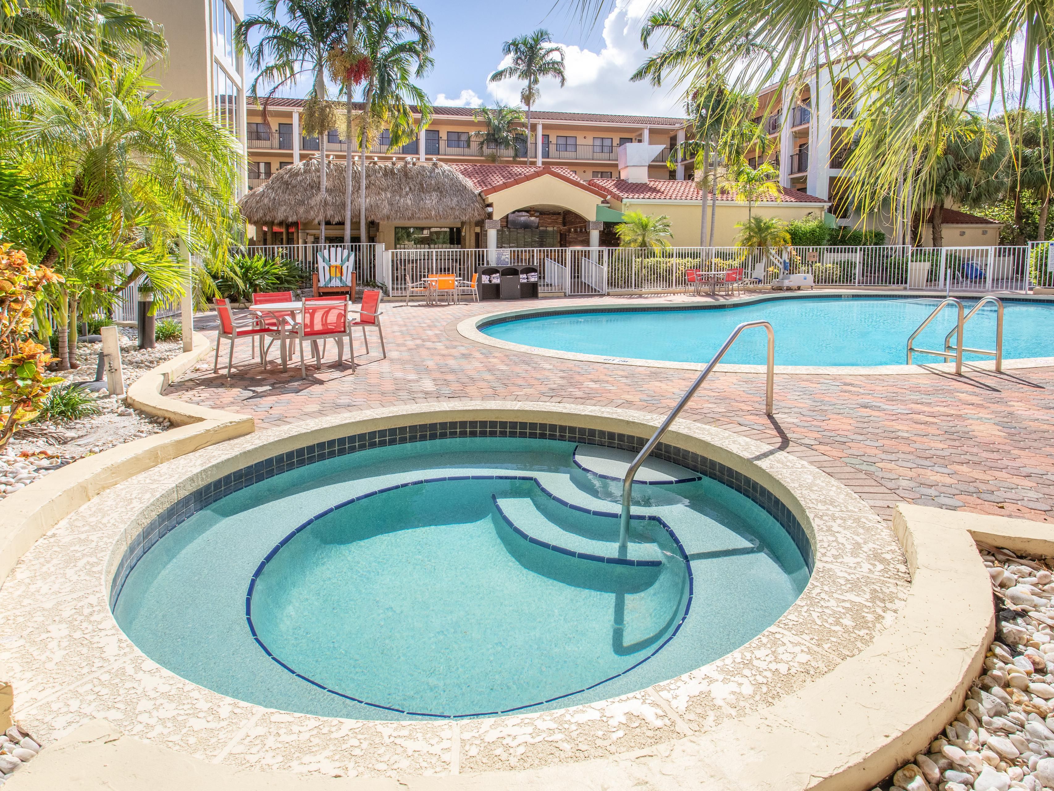 Welcome to our beautiful tropical pool and whirlpool—your perfect escape during your trip to Boca Raton. Leave your worries behind and unwind under the warm Florida sunshine.