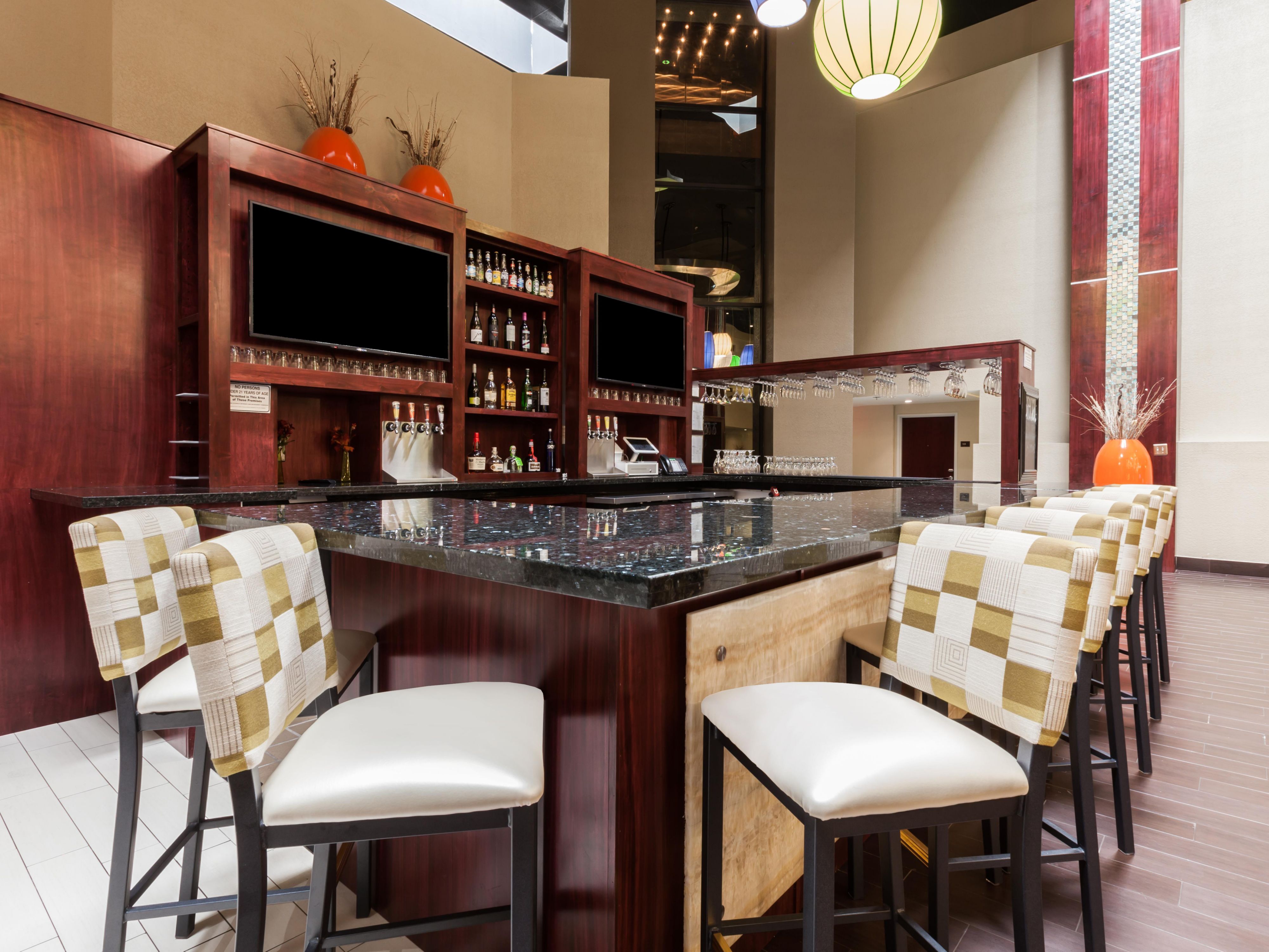 Five miles north of downtown. Close to the Penn Square Mall area and Classen Curve. Full of great local restaurants and shopping along with Automobile Alley provides a lot of great eats with local shopping experience.  If you aren't feeling like getting out stay in at our restaurant Rose Rock have a drink, eat and relax. Open 5p-10p daily. 