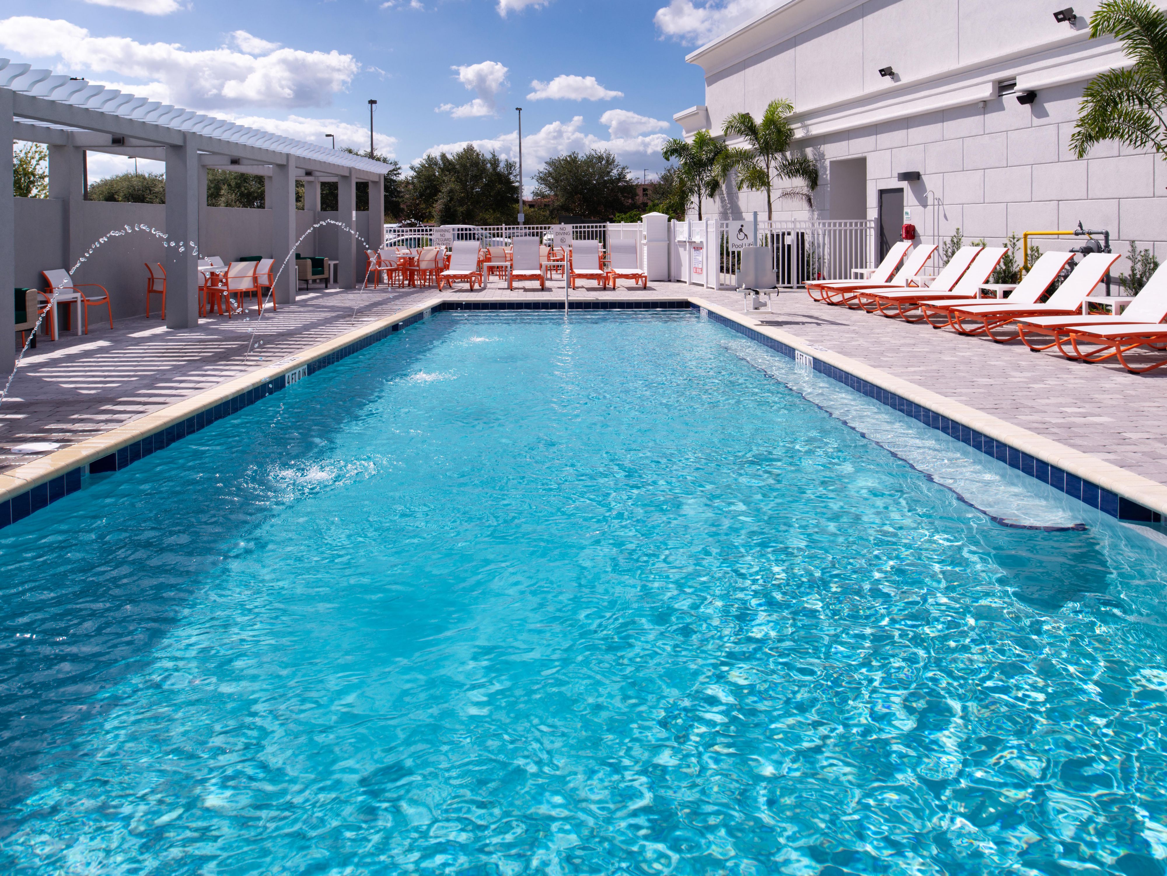 Orlando hotel with outdoor pool and water features.