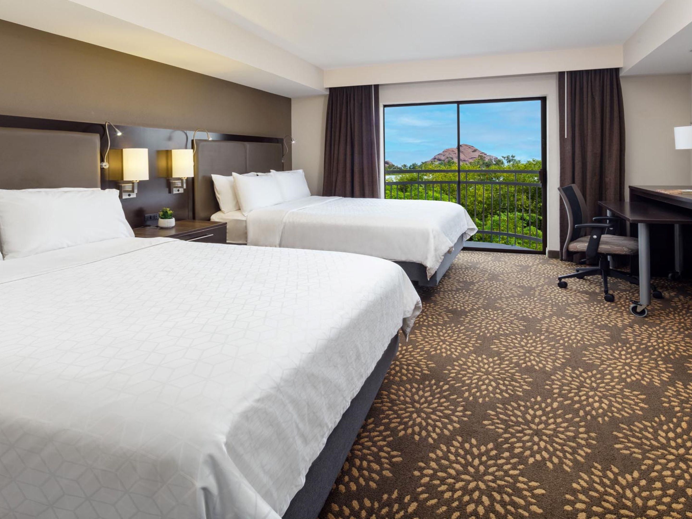 Spacious bedroom area with two queen beds