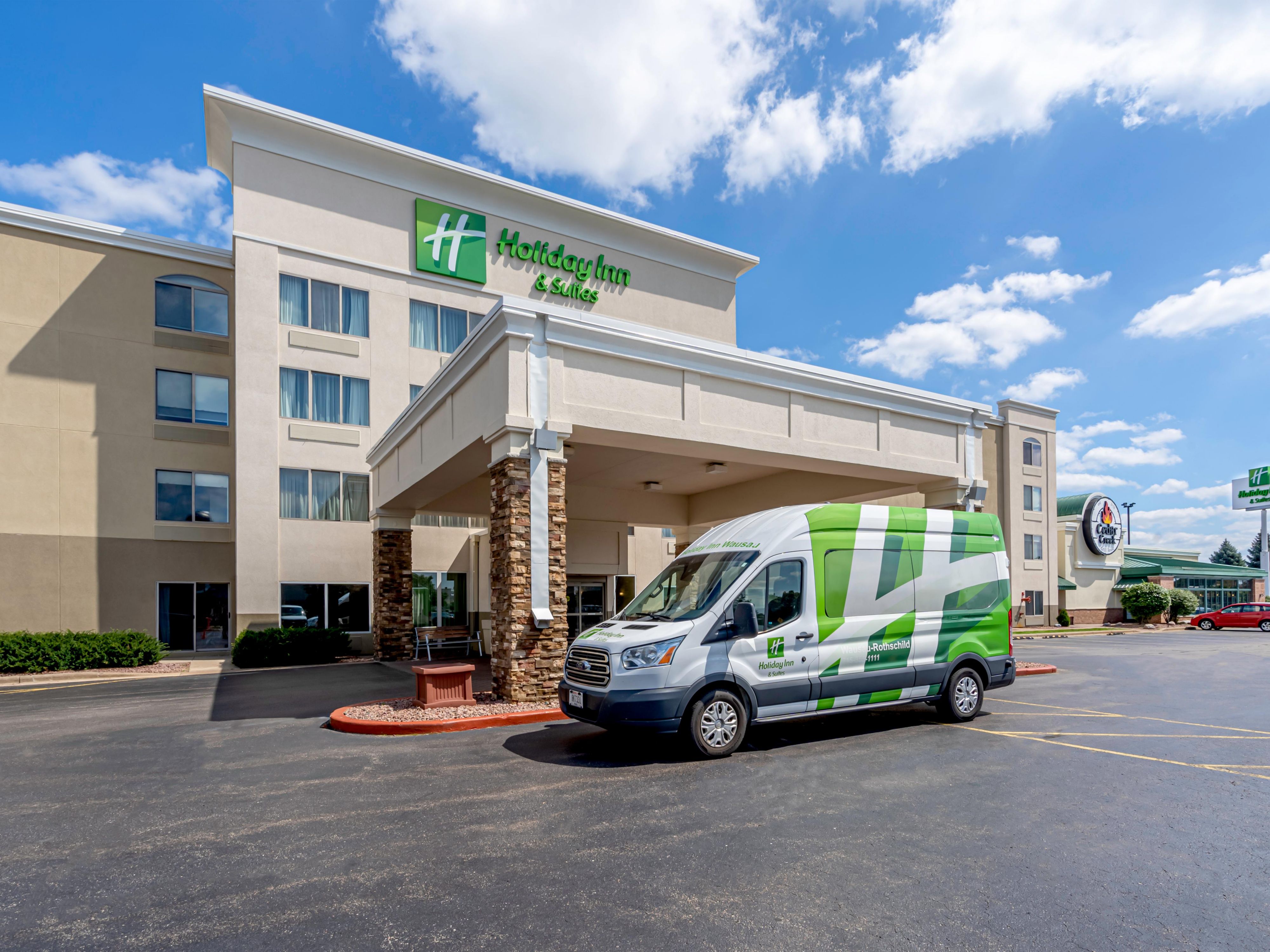 We are pleased to offer free parking for our guests. We offer free Airport shuttles to CWA. If you need to leave your car there is an additional charge. 
Our Parking Lot can accommodate Large Trucks and Buses.