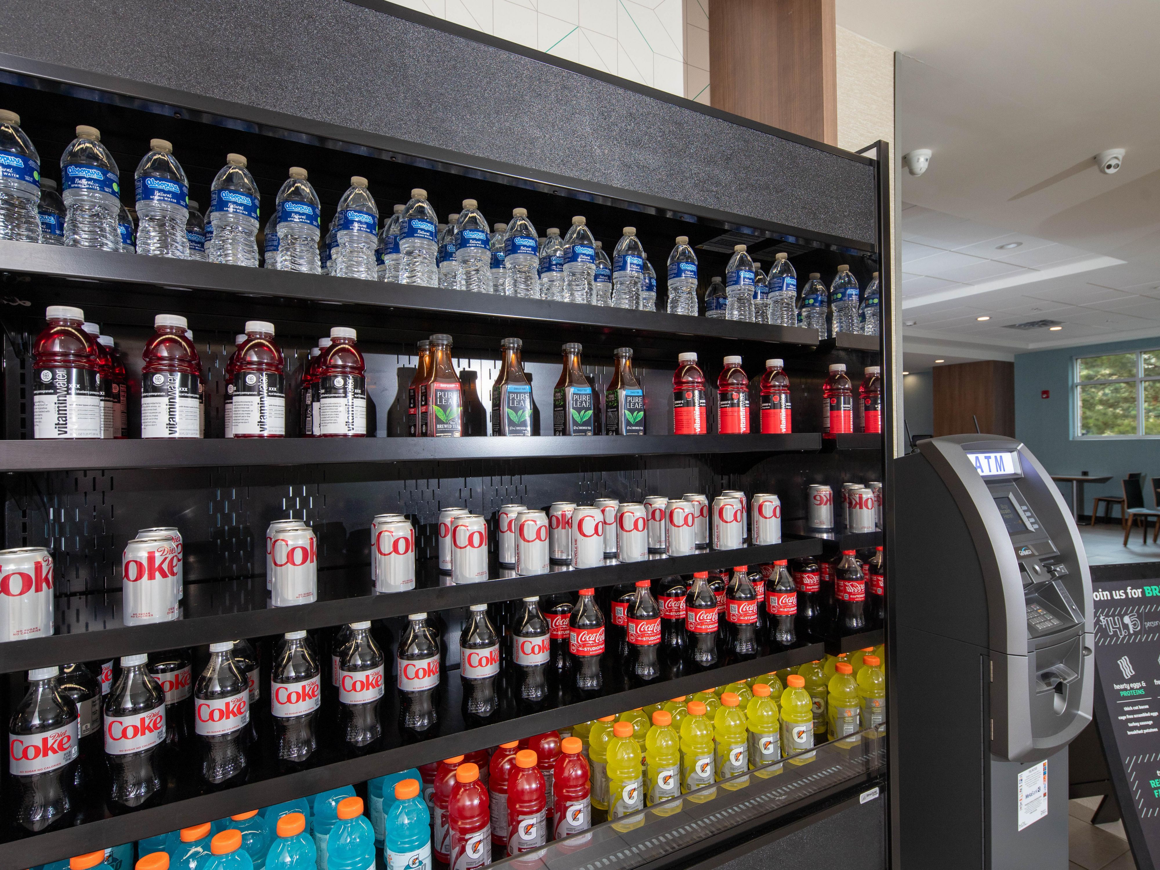 Discover the ultimate convenience at our pantry, where satisfying your cravings is just a step away! Enjoy a variety of delicious snacks, including mini pizzas and ice cream, alongside refreshing beverages like water, juices, sodas and more. Perfect for any time of day!