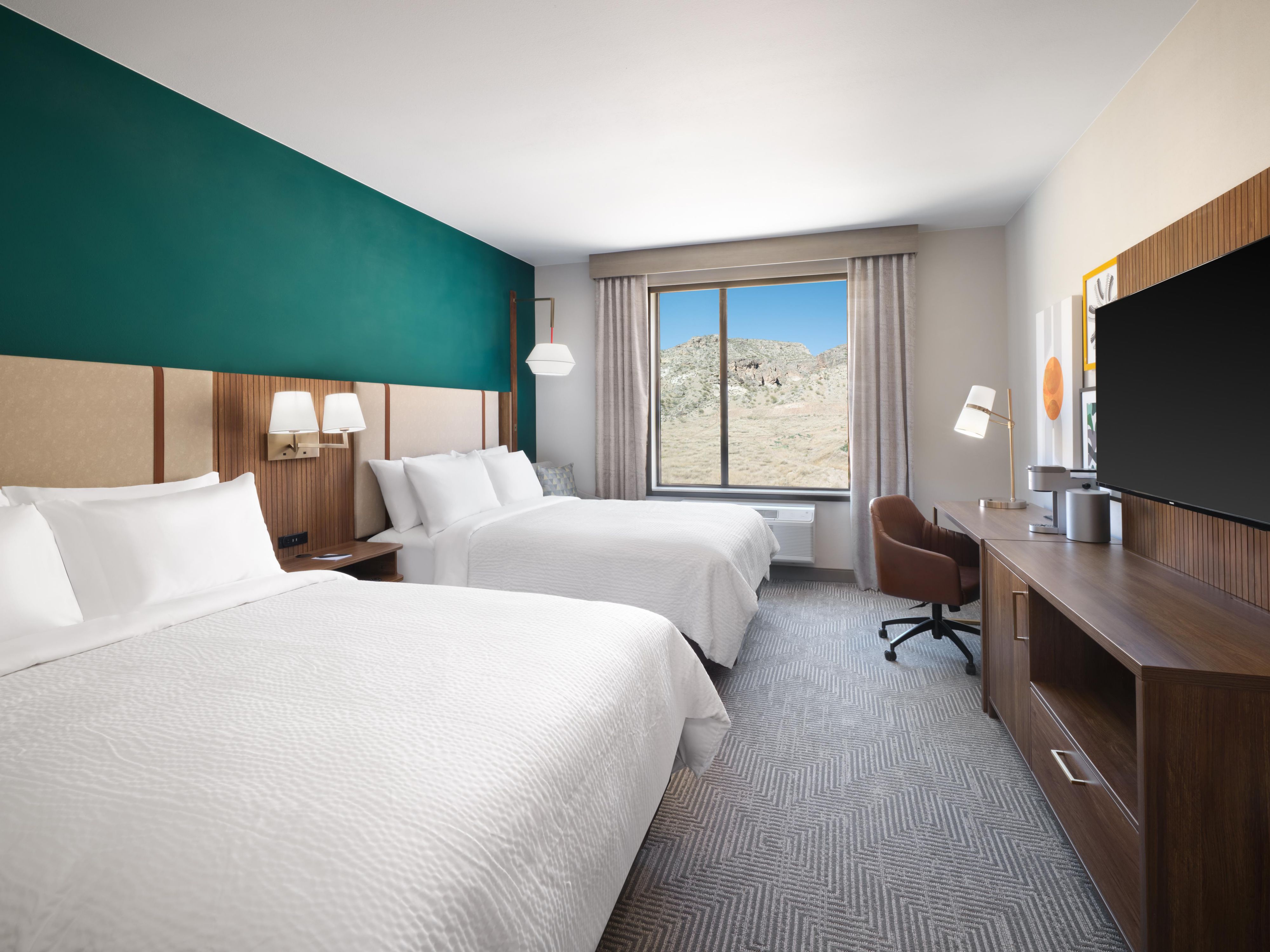 Enjoy our comfy queen beds included in our Zion hotel room.