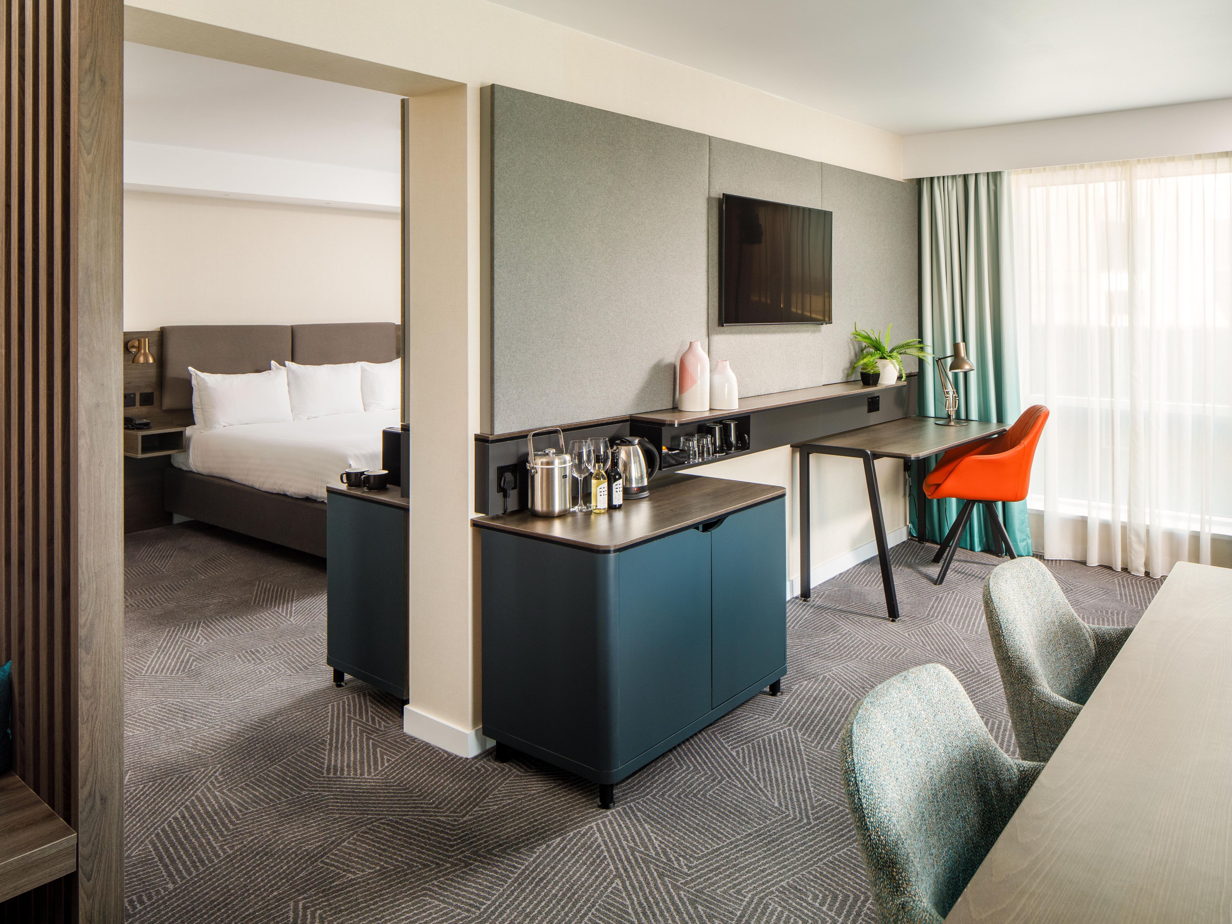 Elevate your stay by upgrading to our premium rooms. Enjoy contemporary decor, a fully stocked complimentary mini bar, and a capsule coffee machine for your convenience.