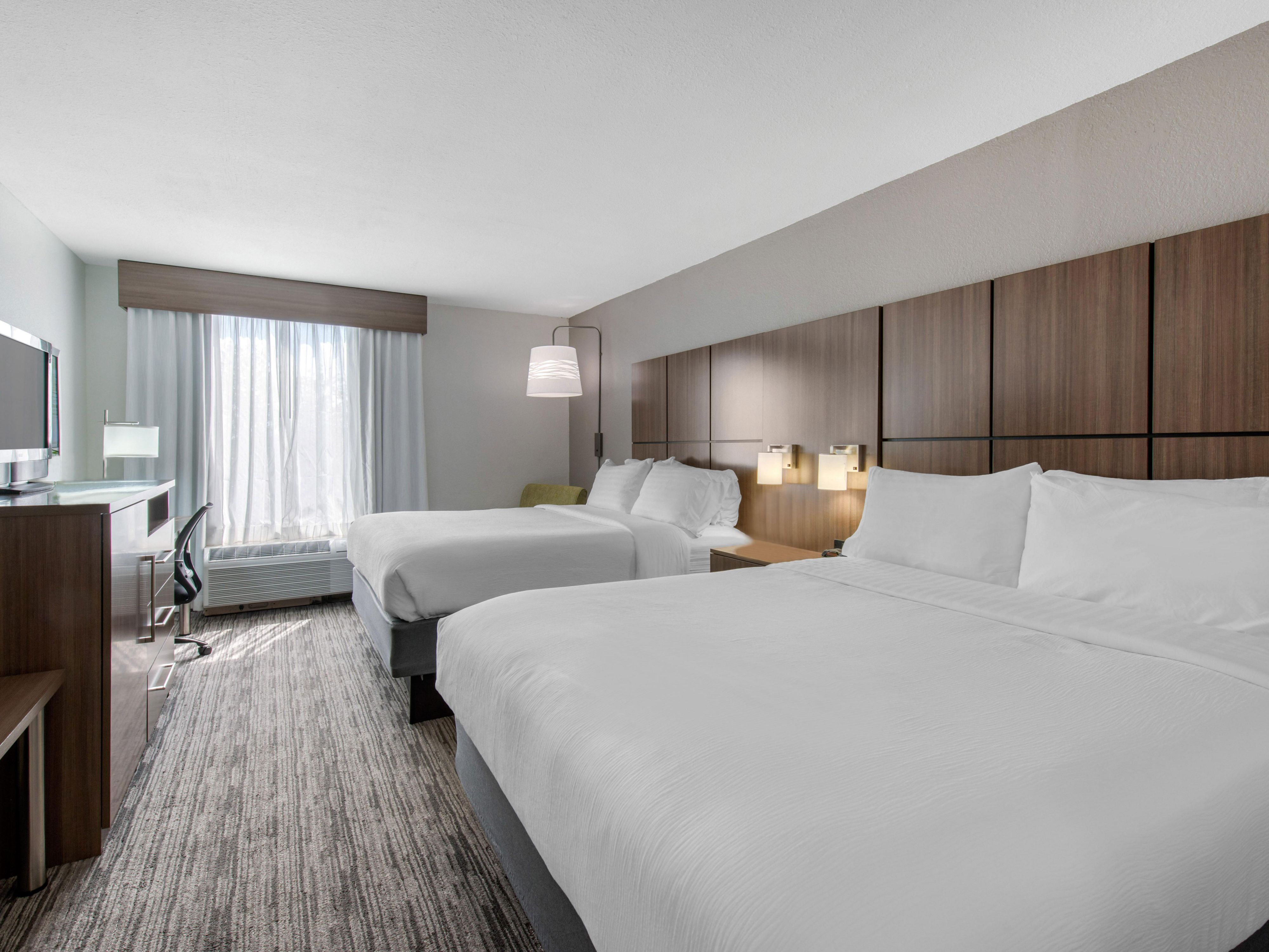 Up to four guests can stay in a room with Two Queen Beds. 