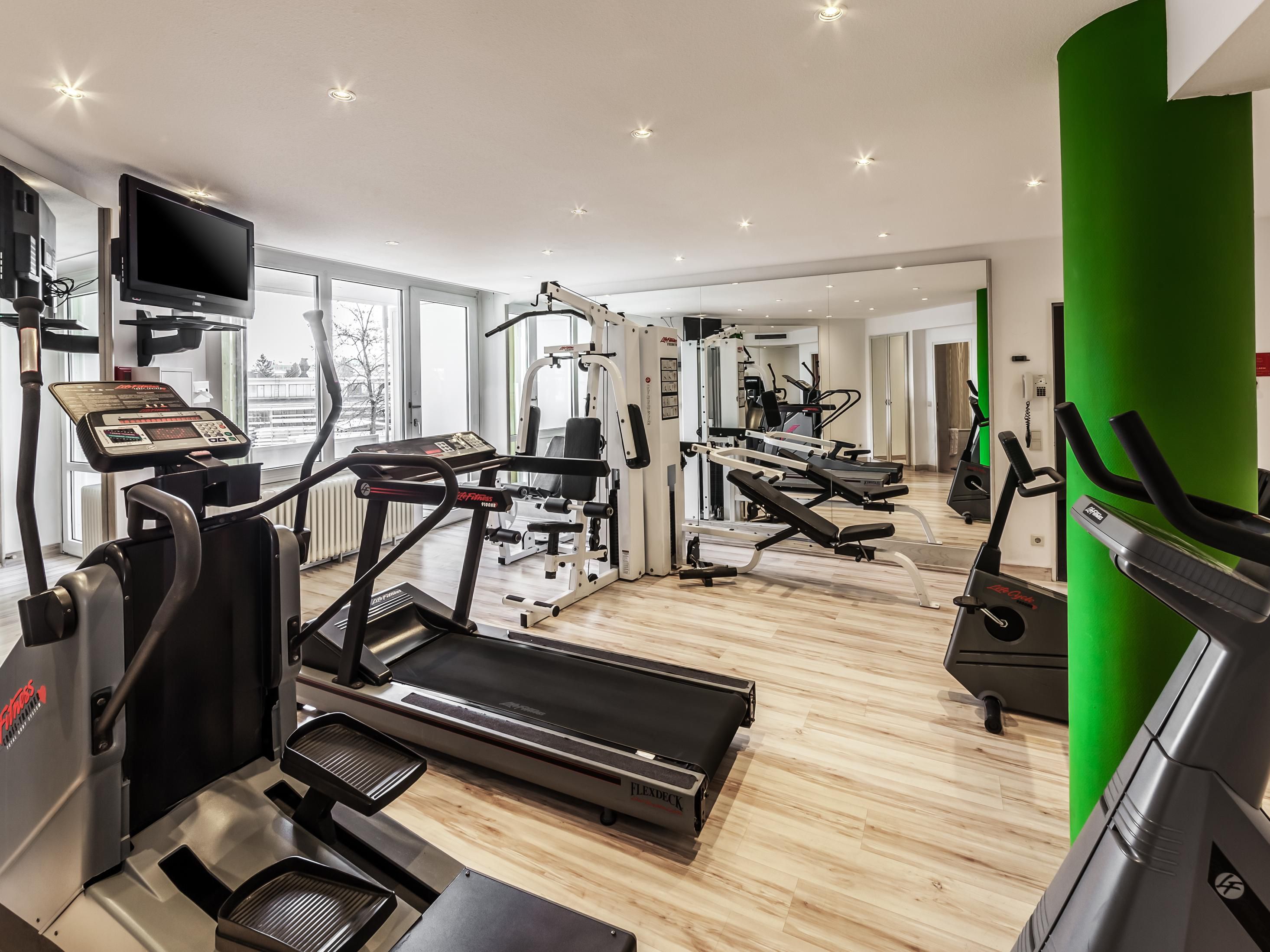 Fitness centre with treadmill, cross-trainer and cardio equipment.