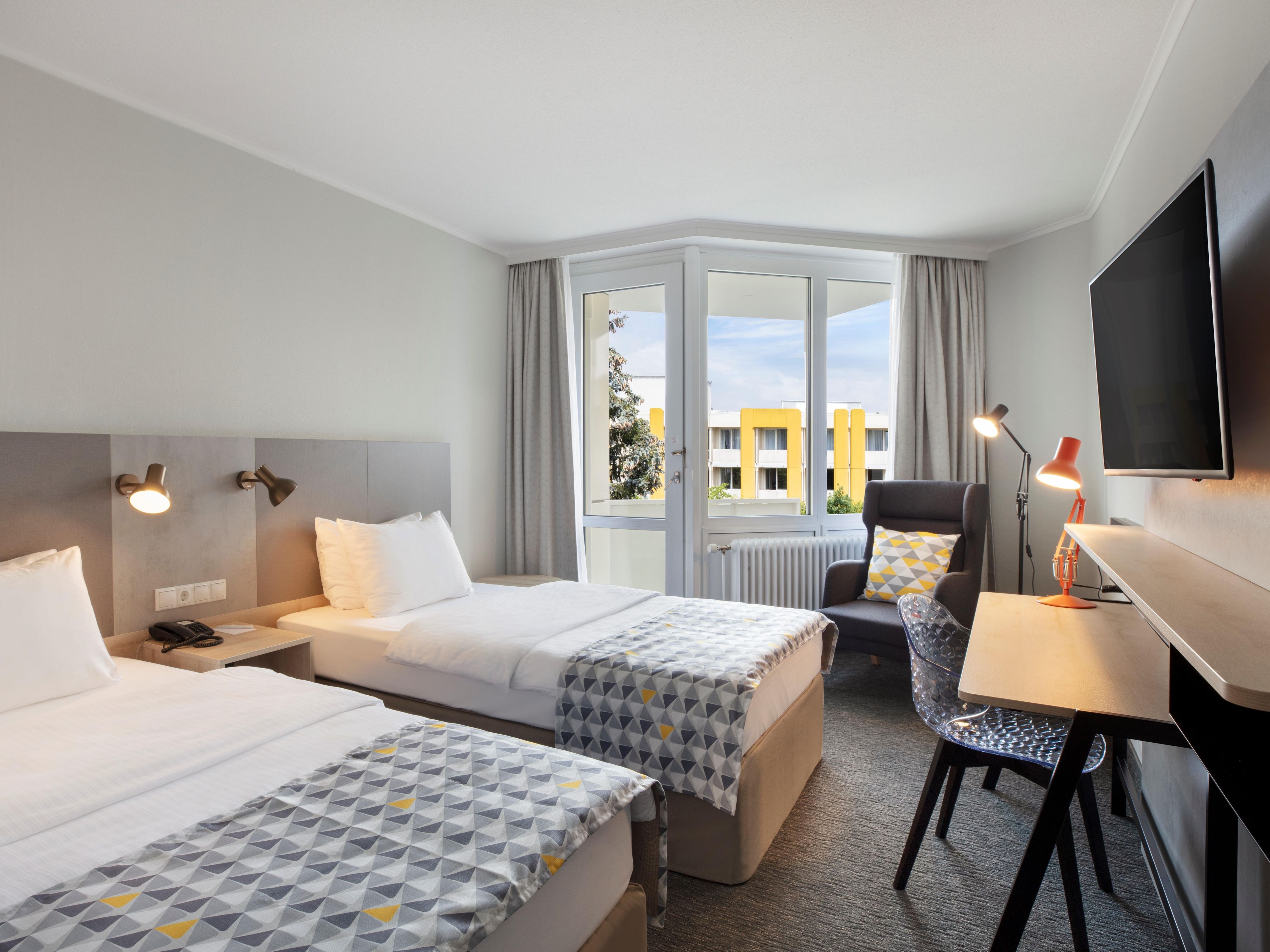 Experience the ultimate in comfort and convenience in our recently refurbished, spacious rooms featuring balconies and garden views. Enjoy entertainment on a flat screen TV and stay connected with free Wi-Fi. With premium bedding, we ensure a peaceful night’s rest in the heart of Munich.