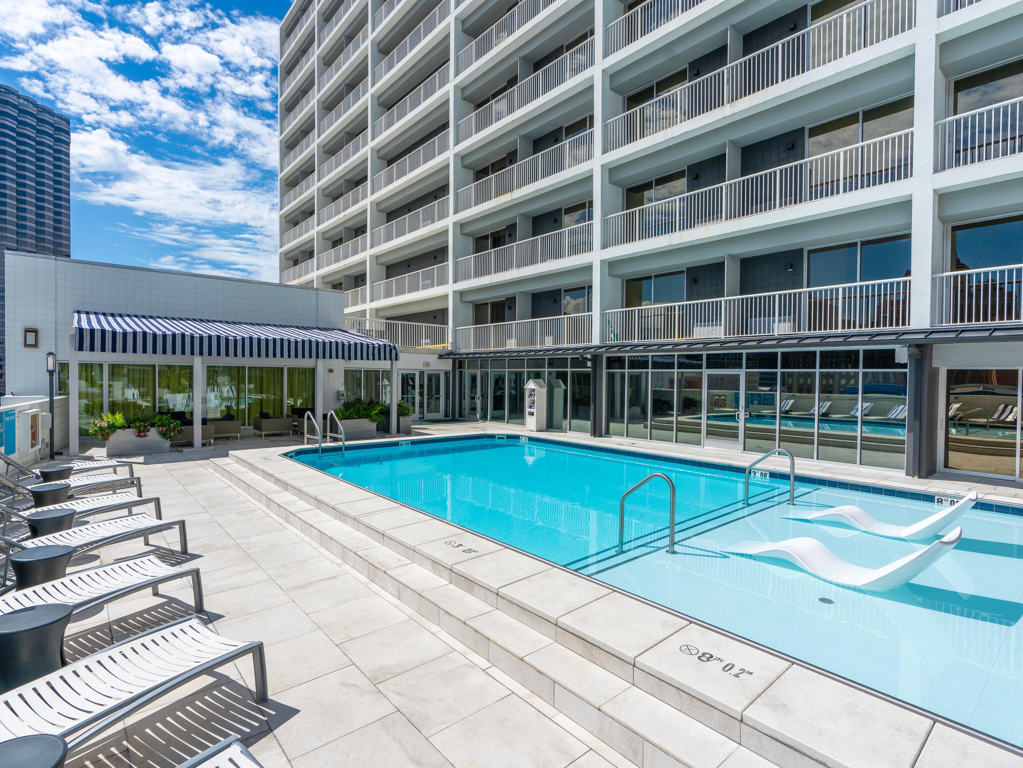 Our spacious outdoor patio is the perfect spot for socializing, networking, and relaxing. Whether you're unwinding after a long day or hosting a casual get-together, the inviting ambiance and comfortable seating make it an ideal setting for any occasion. Soak in stunning city views while you socialize with family or friends.