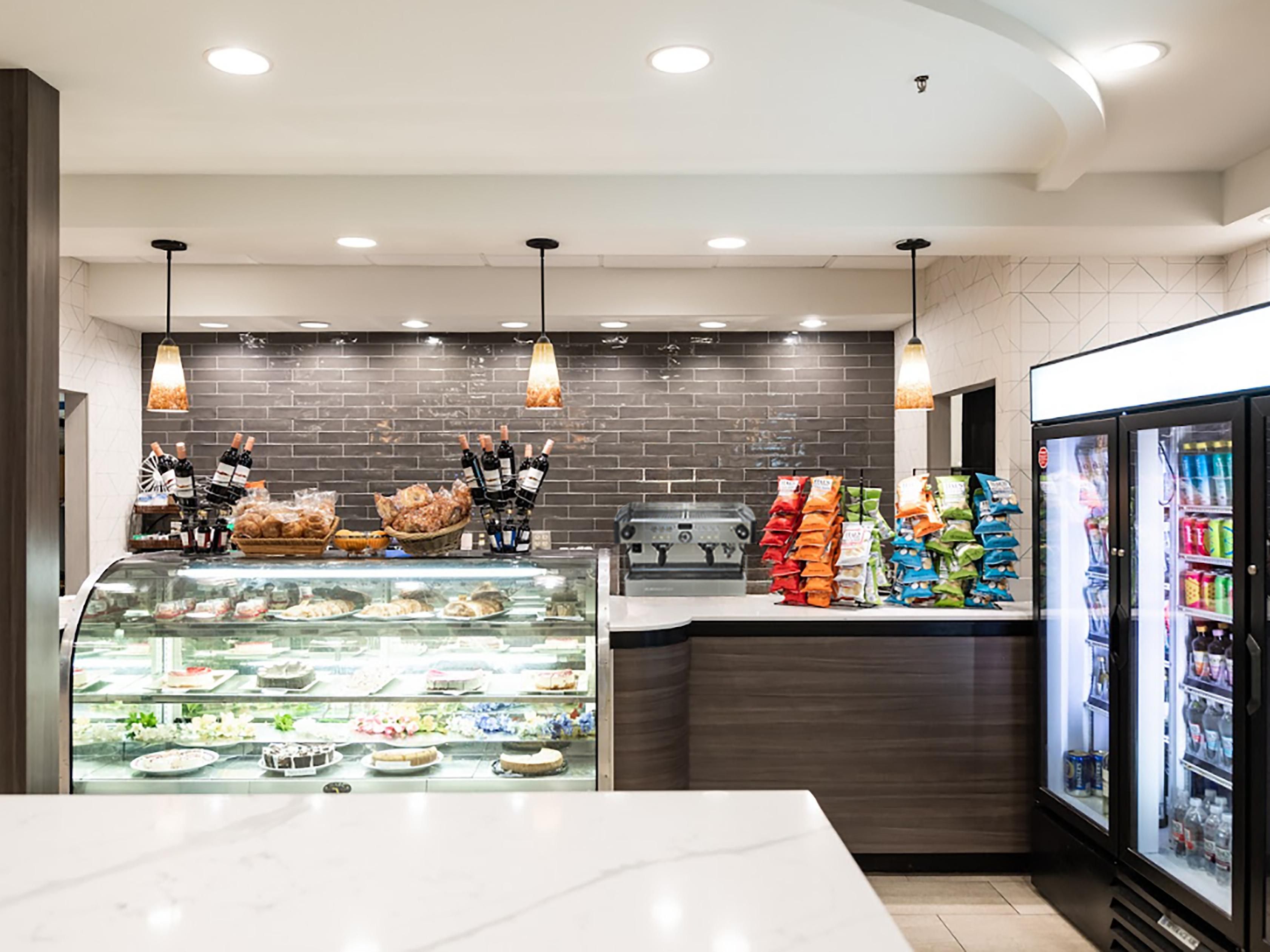 Open 24 hours a day, The Cafe has options that satisfy any craving- hot or cold snacks, muffins, pastries, empanadas, and made-to-go margarita pizza. To complement your meal, we offer a variety of beverages, including coffee, tea, espresso, juice, soda or bottled water. Red and white wine are also available to purchase and enjoy in your room.